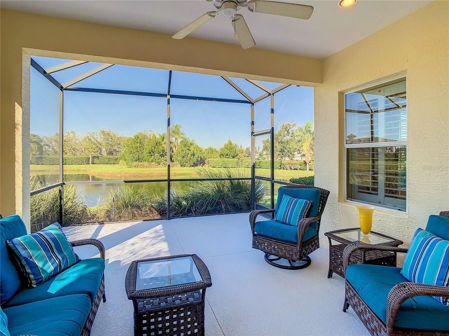 Not just another Eagle Trace villa.  Everyday living is a delight in this FORMER MODEL home with a WATER VIEW.  Beautiful MOVE-IN READY home in a GATED community. Detailed finishes abound.  Recessed lighting in each room.  Optional Architectural trim finishes off the look.   Lovely, high-quality window treatments complement the color palette and décor. Like what you see?  Furnishings available for sale on a separate contract making it super easy to begin your next chapter now.  TRAY CEILING with RECESSED LIGHTING in the Great Room adds to that spacious feel offering plenty of light. Upgraded Kitchen with STAINLESS STEEL Appliances and GRANITE counters and attractive BACKSPLASH. You will enjoy cooking with the GAS stove.  The POCKET SLIDERS bring the outdoors in. They open to the EXTENDED LANAI and create a wonderful OUTDOOR LIVING SPACE with plenty of room to grill and dine and lounge while soaking up the beautiful Florida weather. Split-bedroom plan offers privacy for you and your guests. EXTERIOR PAINTED and Pressure-washed, October 2023. Basic GROUND MAINTENANCE INCLUDED in the low quarterly fee so you can spend your leisure time sitting by the POOL or relaxing in the SPA. Very PET-FRIENDLY community with TWO (2) Dog Parks for your favorite furry friends. Home is an easy walk to the community amenities including TENNIS and PICKLEBALL; plus a PLAYGROUND for outdoor fun!  NO CCD fees with all the advantages of proximity to Lakewood Ranch. Nearby parks, walking and biking trails, shopping and dining. Plus, gorgeous beaches along the coast. The BEST OF EVERYTHING! Looking for easy, pleasant Florida living? Here it is!