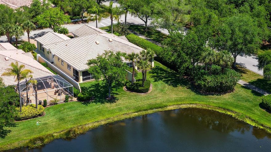 MAKE AN OFFER! This beautiful water view home with two bedrooms and two baths has been lovingly cared for and is loaded with updates. Beautiful 20" ceramic tile in every room, updated kitchen with pot sink, granite counters with rounded edges for counter seating, updated cabinets with pull out shelving and new doors, newer appliances and glass entry door. Faux Fireplace in Living area to warm your heart. The home has had a recent 4 pt inspection, dryer vents have been cleaned, A/C serviced recently, garage springs replaced by Precision Garage Doors, new shower door in master bath and so much more. Clear hurricane shutters allow light to brighten the home with secure protection. Dome solar light in 2nd bedroom for added natural light. Freshly painted throughout. Brinks Safe in Laundry Room. Village Walk is a wonderful unique community, built hurricane safe with poured concrete walls and foundations. Every home in Village Walk is considered to be a Single Family Home, roofs are tied down to the structures, the Florida Building Codes are considered to be above average. Inspectors, roofers and Insurance agents that are familiar with Village Walk will share this information with you. Village Walk is in Flood Zone X, an area that is determined to have little chance of flooding. FEMA updated, 8/2/24. Flood Zone provided by Sarasota County Tax reports. Evacuation zone D, flood insurance is not mandatory, but flood insurance is available. Village Walk power lines are underground with a Sarasota Fire Department just down Honore. Seldom losing power. Amenities include 24 hour guarded gate, geo-thermal heated and cooled lap & lagoon pools, six Har-Tru Tennis courts, Pickle ball, Bocce' ball and Basketball courts, State of the Art fitness Center, Miles of walking and bike paths, over 500 acres of lakes and preserves. There are over 50 activity groups who meet daily, weekly, or monthly. Plus there is a full service Cafe with full service Bar, Gas Station, Barber shop/Hair Salon, and Gift Shop. A special NOTE is that Village Walk did not lose power during the hurricanes and there was No flooding. What a Fantastic Place to Call HOME!