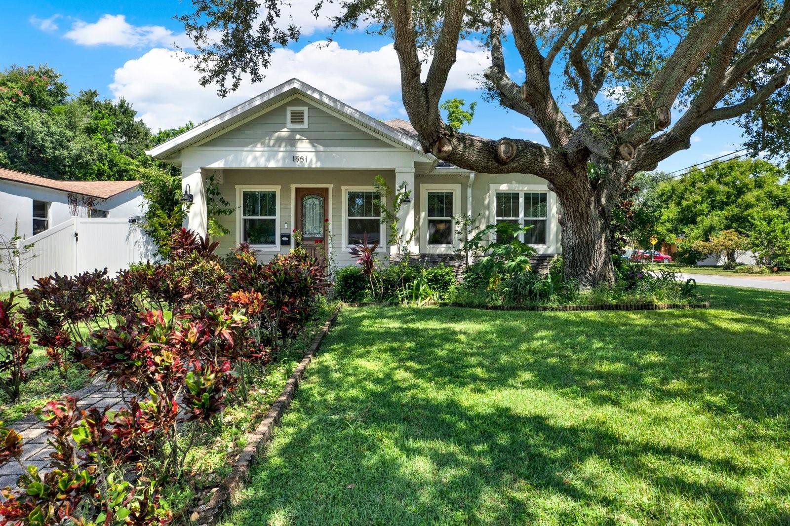 One or more photo(s) has been virtually staged. Welcome to this charming newer-construction home in the highly desirable Greater Woodlawn neighborhood of St. Petersburg. Just 5 minutes from Central Ave, 7 minutes to Downtown St. Pete and the Pier, 15 minutes to St. Pete Beach, and 21 minutes to Tampa International Airport, this location makes it easy to enjoy the best of Florida living. Conveniently located just minutes to I-275, providing quick access to Tampa and the Skyway bridge. From award-winning restaurants and trendy coffee shops to boutique shopping, fitness centers, and vibrant nightlife, everything you love about St. Pete is right at your doorstep—all while enjoying the quiet charm of a tucked-away residential neighborhood.
Built for both style and durability, this home is located in a non-flood and non-evacuation zone and features hurricane impact windows, with a brand-new hurricane impact front door already on order. Inside, you’ll find 4 spacious bedrooms, 2 and a half bathrooms, 8-foot interior doors and 10- foot ceilings throughout. The open-concept kitchen, living, and dining area is perfect for entertaining, offering plenty of space for gatherings and storage for appliances, dishware, and seasonal decor. This home also comes equipped with a Nuvo water softener, irrigation well pump, gutters, and downspouts.
The primary suite, privately situated at the rear of the home, is bright and airy with two walk-in closets and a spa-like ensuite featuring dual vanities, a private water closet, and an oversized shower. 3 additional bedrooms and a full bath are located at the front of the home, providing a thoughtful split layout.
Step outside through triple sliding glass doors to a covered lanai that overlooks the sparkling saltwater pool and landscaped garden. The detached 2-car garage sits at the back and side of the property, connected to the home by a covered walkway that keeps you cool in the sun and dry in the rain. This flexible space could even be converted into an in-law suite or expanded with a second level.
Recent updates include a new water heater, pool pump, kitchen faucet, and a new garage door spring. With its prime location, modern upgrades, and lifestyle convenience, this home is truly a rare find in one of St. Pete’s most desirable hidden-gem neighborhoods. Opportunities like this don’t come around often—schedule your showing today!