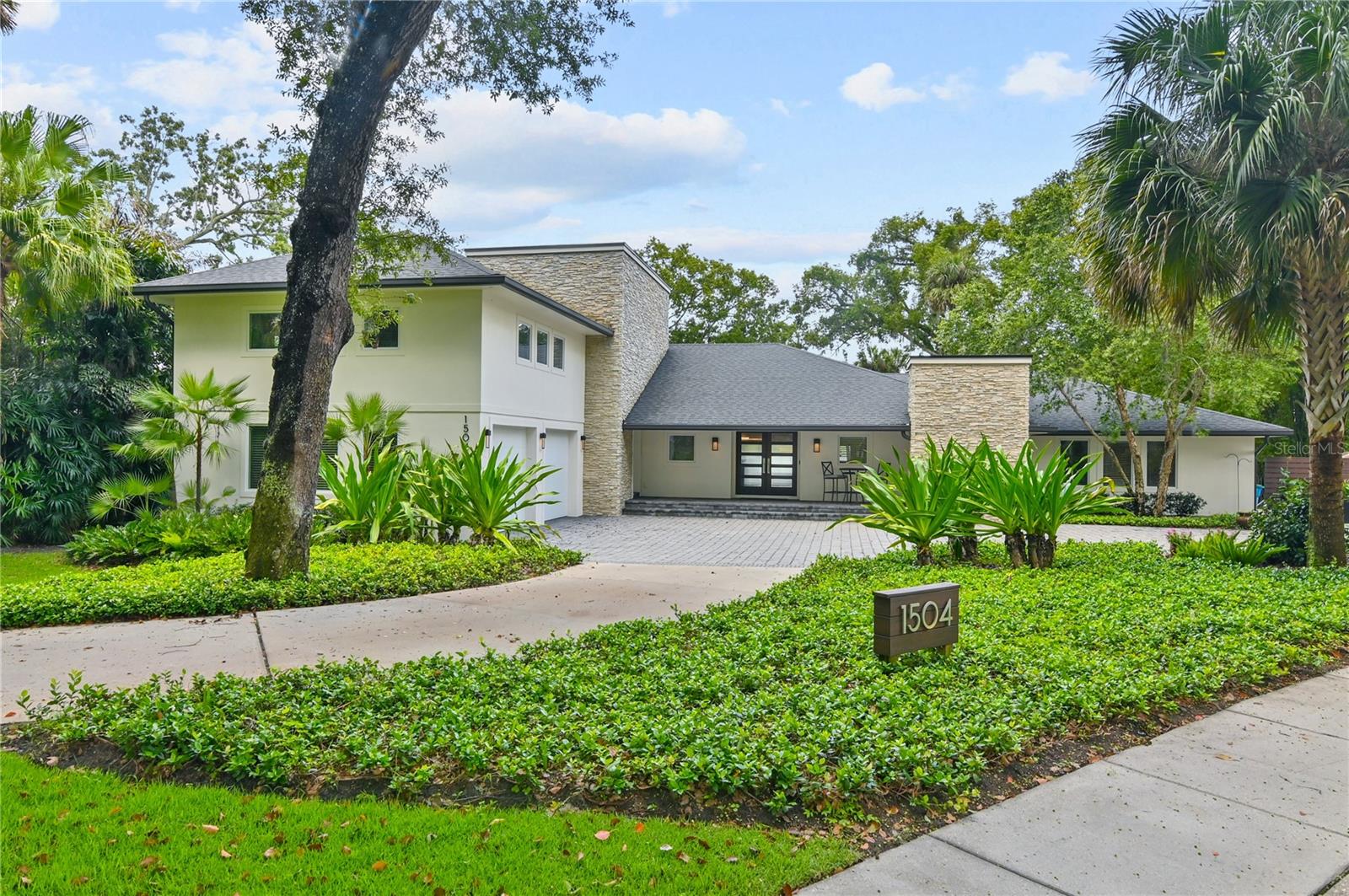 Welcome to this exceptional Phil Kean built home that offers luxurious features and ample space for comfortable living. With 5 bedrooms, 5.5 bathrooms, and an impressive 5013 square feet, this home is ideal for a large family or those who love to entertain. Situated on an elevated lakefront view, you'll enjoy breathtaking scenery and a tranquil atmosphere.
As you step inside, you'll be greeted by the elegance and craftsmanship that defines this residence. The home boasts a two-car garage, providing convenient parking for your vehicles. The interior is adorned with high-end finishes and luxury appliances that will make everyday living a pleasure.
One of the highlights of this home is the outdoor living space. Imagine hosting memorable gatherings with family and friends in the expansive outdoor kitchen, complete with all the amenities you need for al fresco dining. The saltwater pool with a sun deck offers a refreshing retreat during hot summer days, while the massive Lani with roll-down screens provides a comfortable space to relax and enjoy the view.
For those who love boating and water activities, this home is a dream come true. It features a private boat dock with Trex decking, allowing easy access to the Winter Park Chain of Lakes. The massive lot provides ample parking space for your guests, ensuring that everyone feels welcome.
Inside, you'll find a loft area that can serve as a versatile space for guests or additional entertainment. The loft is complemented by a massive guestroom, providing privacy and comfort for visitors. Additionally, the whole house generator ensures uninterrupted power supply, and the new AC installed in 2023 keeps the home cool and comfortable year-round.
In the evenings, gather around the gas fire pit and enjoy cozy conversations under the starlit sky. This energy-efficient home and its features ensure that you can enjoy modern amenities while being mindful of the environment.
Don't miss out on the opportunity to own this extraordinary Phil Kean built home. With its spacious layout, stunning lakefront view, and abundance of amenities, it offers the perfect blend of comfort, style, and functionality. Contact us today to schedule a private tour and make this dream home your own!