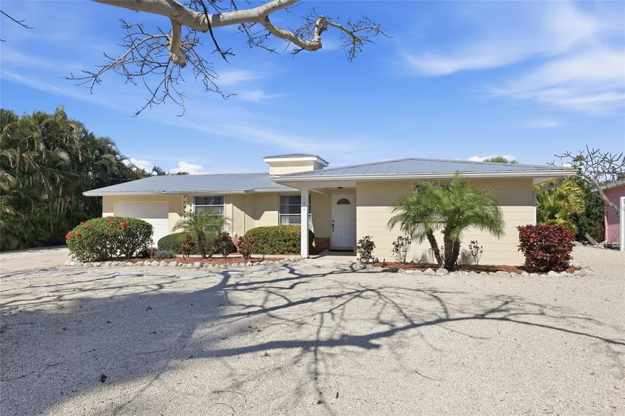 Delightful waterfront home on the famed North end of Anna Maria Island.  This 2 bedroom 2 bathroom home offers incredible opportunities for adventure.  Whether it is the sand of the Gulf beaches you seek or if enjoying the water from a boat, kayak, or paddle board is your thing the choice is yours.  Another incredible benefit of this location is the proximity to Pine Ave, full of fun shopping and eateries.  Generously sized lot is positioned on a cul-de-sac providing privacy due to no through traffic.  Concrete block paired with a metal roof creates a formidable structure.  As you enter the home you will be welcomed by a sense of coziness.  The kitchen features solid wood cabinetry and exquisite Taj Mahal quartzite countertops.  Entertaining is aided by the in-ceiling home speaker system.  Enjoy year around serene water views from the 300 square foot screened-in lanai equipped with four ceiling fans.  Single car garage for all your storage needs or get creative for a possible third bedroom.  The large lot leaves ample room for a pool to the front of the house.  Schedule a showing today and discover if this piece of paradise if right for you.