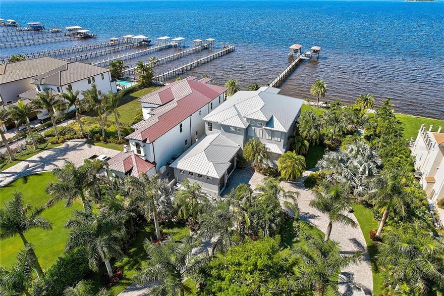 The “Surfside-Waterfront- Estate” at Apollo Beach, offers 120ft of Tampa Bay waterfront with amazing sunsets and endless panoramic views of Tampa Bay, Downtown Tampa/Downtown St Petersburg’s Skyline as well as the Landmarked “Skyway Bridge”. The home boasts, some the most luxurious amenities, design and luxury living to include; Private Doubled Gated Access, 3-Stop Elevator, Generac Home Generator, Completely Fenced, Pavered Circular Driveway/Walkways throughout the grounds, a 300ft Composite Dock w/Covered Boat Lift(18K), a Jet Ski Lift and 2 Paddle Board Lifts.
Elegant double front doors allow entry into this 5-Bedroom, 4-Bathroom & 1½ Bath Home. Your greeted with breath taking views and natural lighting. The 1st floor Owners Retreat is an elegant space with a bayfront sitting area and lanai, take the elevator to the 2nd floor to find additional 4 Bedrooms/ 3 Baths, living area, wet bar w/refrigerator and lanai.
Luxury appliances include: 5 Burner "induction" Mercury Professional Range, GE Café series 30” french door wall oven w/ warmer drawer, Monogram Drawer Microwave, Thermador Topaz silent dishwasher, Kruas Undermount Sink, April Aire Filtration/Dehumidifiers and more. The Flooring/ Back Splash/Counter spaces and Bath Walls includes; Porcelain, Marble, Quartzite, Luxury Tile, and Glass Tile. Custom High End Soft Close, Under-lighting Cabinetry and hardware throughout includes; Robern Mirrors (medicine cabinets) and Mid Continent. The Elan, Smart Home A/V system allows simplistic control of audio/video/surveillance devices and be entertained by the Sonos Surround System throughout the Home, Garage and Lanai’s.
Enjoy Luxurious Outdoor living with the Infinity Edge Saltwater Pool surrounded by Travertine Tile, Screened Lanai, Outdoor Kitchen w/ LYNX 42” Stain Steel Grill w/ Side burner, hood and blower. The grounds have "Lush Tropical Landscaping" with “Mosquito Misting System” allowing the most pleasant level of Florida Outdoor Lifestyle/Living. The enormous 3 Car oversized garage, with custom hurricane rated garage doors and a large w/ac workspace. 
This is truly a ONE-OF -A KIND Home, located in one of the most sought-after areas in Apollo Beach and is one of the most unique properties in the Tampa Bay area. To many aspects and features to describe. This home is IMPRESSIVE and a MUST SEE! This is the “GEM” Call Today!