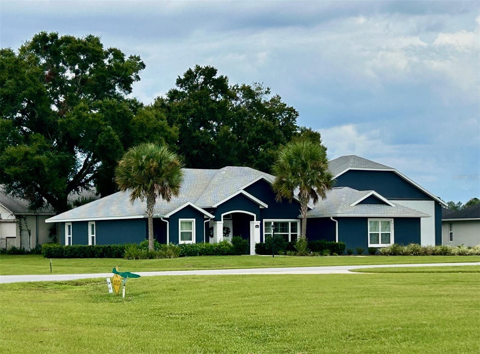 Rare opportunity for some lucky pilot!! Exquisite 3/2 home and hangar in the wonderful community of Leeward Air Ranch. This almost new home shows off from the street with a dark blue palette trimmed in white. Open the double doors and see the home looks like a model. All the latest finishes throughout including luxury vinyl flooring that looks like an expensive tile but so much more comfortable and easy to maintain. Open floor plan to the designer kitchen with it's real wood cabinets, quartz countertops, center island, stainless steel appliances and large pantry. Recessed lighting and Bahama shutters! The living area has a built in sound system that stays with the house and a view out to a covered and screened patio. The primary bedroom is spacious and has a tray ceiling and a large walk in closet. An ensuite spa-like bath features a soaking tub, separate shower and double sinks. So much more, water softener, drip irrigation system, gutters with leaf filter, gardens with path lighting. The attached 35x48 hangar is insulated and equipped with a ductless mini-split air conditioner. The floor is beautifully finished and ready for your airplane! This home is very close to the grass turf, lighted 6200' x 165' N-S runway. This airpark is a fun place to live with activities in the Red Barn Community Center. There are weekly fly outs and bi-annual fly ins. Other activities include yoga, bridge, art, fitness, motorcycle rides, hangar happy hours, bingo, bunco, and holiday gatherings. Blue skies all year long for your flying enjoyment whether you fly a single engine, bi-plane, float plane, glider, chopper or warbird, you will be in good company! Buyer must own an aircraft and have a current pilot’s license.