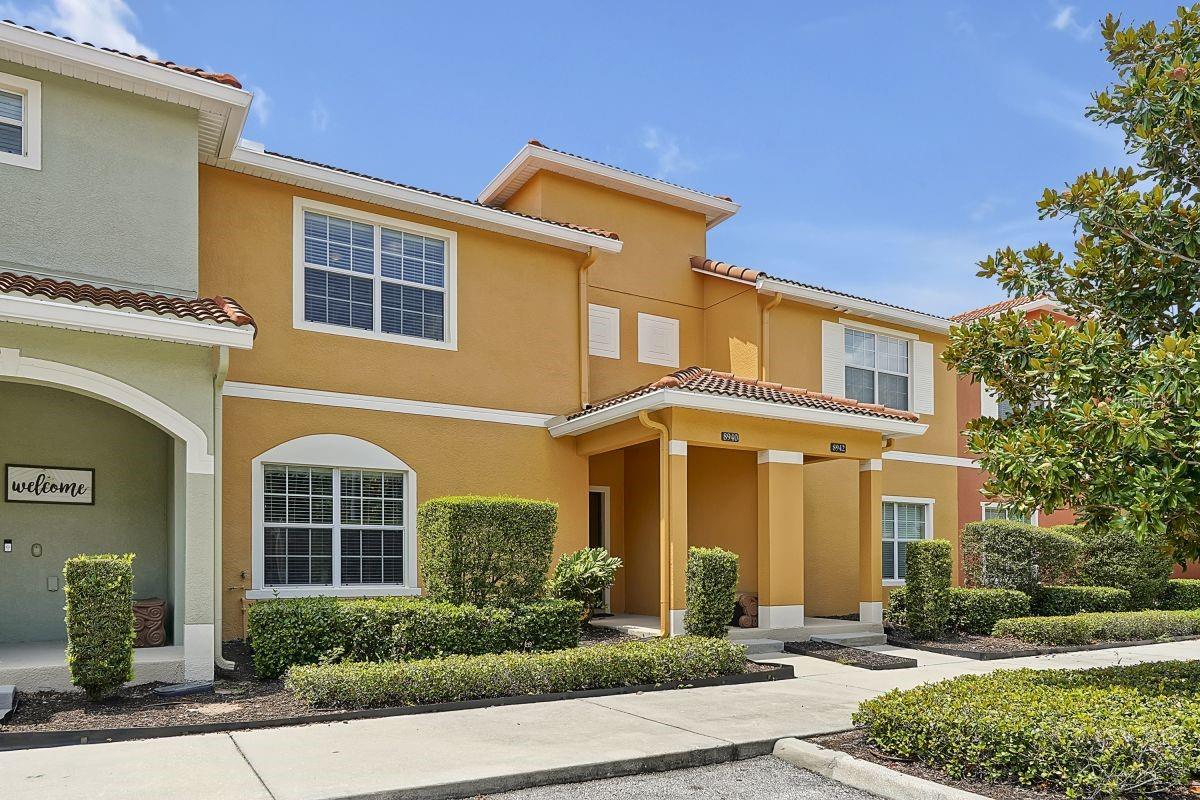 Rare waterfront townhome in Paradise Palms Resort! This fully furnished 4BR/3BA home offers stunning water views from your private screened splash pool & lanai—one of the few waterfront units available in the community. Step inside to an open-concept layout featuring a modern kitchen with stainless steel appliances, granite countertops, and a spacious living and dining area—perfect for entertaining or relaxing after a day at the parks. Thoughtfully laid out with 1 king suite upstairs, 1 downstairs bedroom with a king bed, and 2 additional upstairs bedrooms, each with a full and twin bed. Additional features include flat screen TVs in every bedroom, high-speed WiFi, and full-size washer/dryer. Located just minutes from Walt Disney World, shopping, dining, and major highways, this home is zoned for short-term rentals and offers strong rental income potential. Don’t miss this opportunity to own one of the most sought-after waterfront units in Paradise Palms! Resort amenities: gated entry, lagoon-style pool with tiki bar, hot tubs, fitness center, theater, arcade, splash pad, tennis, basketball & more.