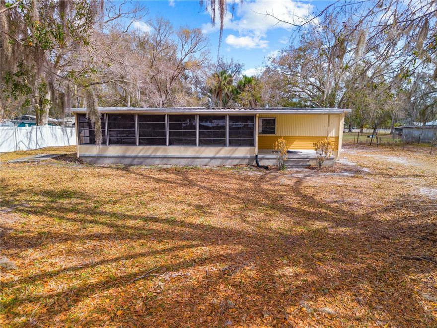 Welcome to your slice of Old Florida charm in the desirable Lake Marian Highlands area of Kenansville! This beautifully remodeled 1972 split-plan mobile home offers 2 bedrooms and 2 baths, blending comfort, efficiency, and relaxed country living on a spacious .53-acre lot shaded by gorgeous mature oaks. The 12 X 12 covered front porch is a welcoming spot to visit with friends. Step inside to discover a fresh, updated interior and two brand-new mini-split systems providing efficient heating and cooling. The impressive 28x12 enclosed porch features a concrete floor, vinyl windows, and its own mini split, adding 336 sq. ft. of versatile living space — perfect for a family room, hobby space, guest area, or home office. Outside, enjoy a 10x33 covered carport with storage shed, ample parking, and one of the larger lots in the area — ideal for future expansion, storing boats or toys, or simply enjoying wide-open space and privacy. Located outside the HOA, and just minutes from the Lake Marian Boat Ramp, this property is a dream for anglers, nature lovers, and weekend adventurers. Lake Marian spans 6,000 acres and 8 miles in length and is renowned as one of Florida’s best crappie fishing lakes. Surrounded by over 110,000 acres of wildlife preserves and working ranchlands, the area offers unmatched tranquility and natural beauty.