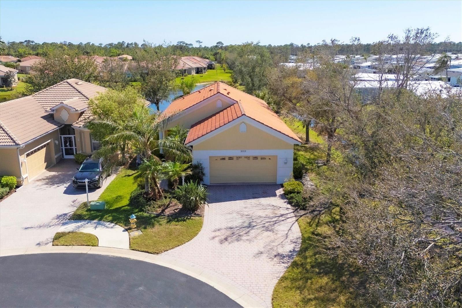 This little gem is tucked away at the end of the cul-de-sac and walking distance to the community pool. This home has 3 bedrooms, 2 baths, a 2 car garage and a screened lanai with stunning water views. You’ll find high ceilings, charming archways, breakfast bar in the kitchen, tile floors and an open floor plan for entertaining. Highly desired location of Talon Bay, is a gated community with a well-managed association that includes the outside maintenance, roof replacement, exterior painting of the house, lawn maintenance and shrub trimming in the HOA dues. This retreat will be worry-free living at it’s finest. Indulge in the community amenities, including a clubhouse, heated pool, tennis and pickleball courts, and a fitness center, all connected by convenient sidewalks. Pet friendly. It’s close to plenty of shopping, farmers markets, the Cool Today Park/Braves stadium at Wellen Park, I-75 and many restaurants to enjoy. This is the one for your full-time residence, seasonal getaway or investment portfolio.