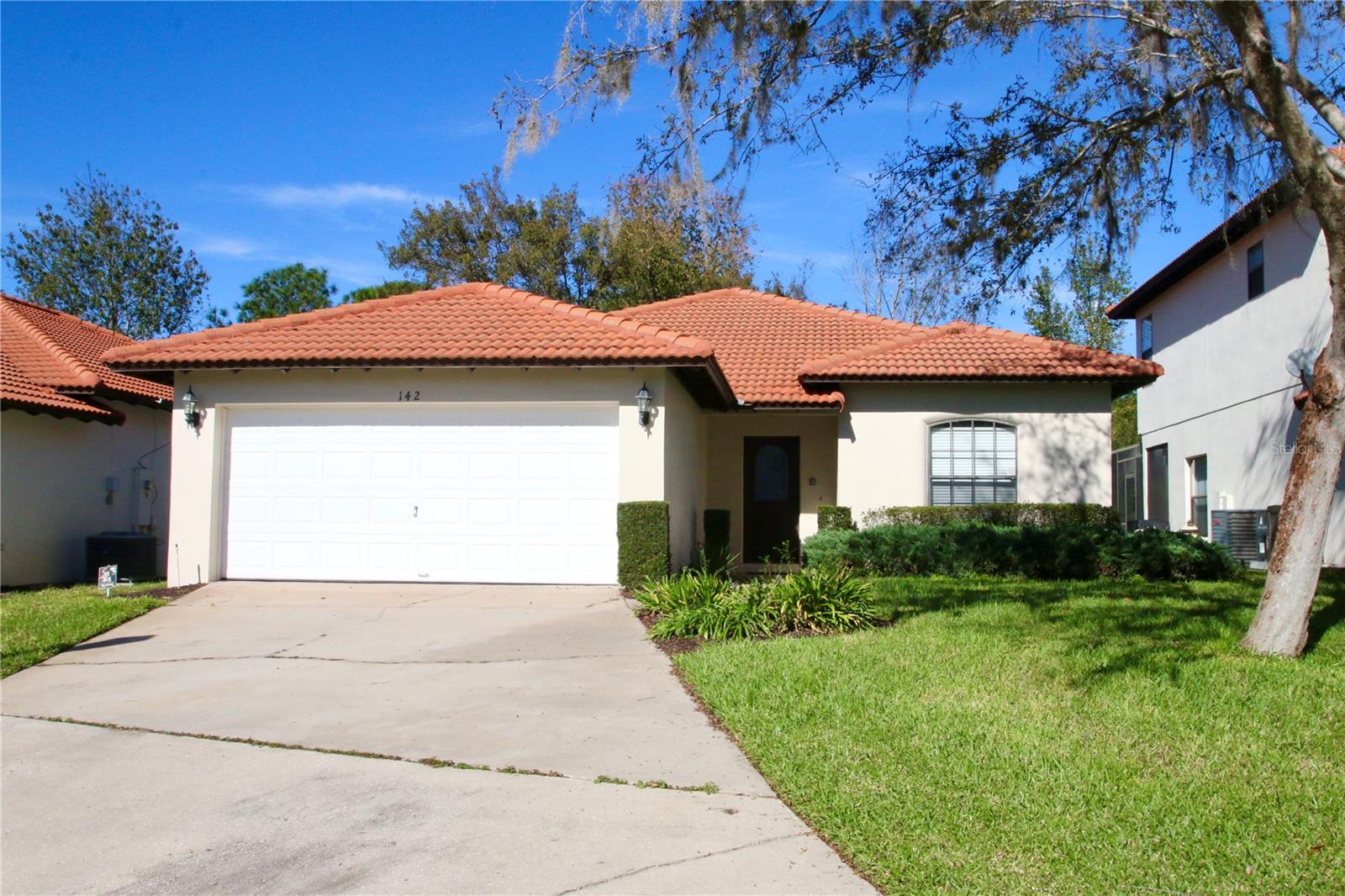 Escape to your own personal retreat in the highly sought-after, gated community of High Grove Resort! This well maintained, fully furnished pool home with the Mediterranean style terracotta tile roof, offers the perfect blend of escape, comfort and convenience.
Step inside to discover a bright and airy open floor plan, perfect for modern living and entertaining. This home offers a spacious kitchen featuring a large central island, ample counter space, and a full suite of appliances – ready for you to create memories from day one.
Your private, screened-in lanai and sparkling pool are the heart of your personal retreat. Imagine sipping your morning coffee in the warm sun or unwinding with a refreshing swim after a day at the parks.
The resort lifestyle extends beyond your doorstep. Enjoy access to the exclusive clubhouse, fitness center, resort-style community pool, and a relaxing hot tub.
Unbeatable Location: Situated just minutes from the magic of Walt Disney World and with effortless access to major highways, you're at the center of it all. World-class shopping, dining, and entertainment are just moments away, making this the ideal location for a primary residence, a short-term rental, or the ultimate vacation getaway.
This is more than a home; it’s a lifestyle. Don’t miss your chance to own this turn-key treasure. Schedule your private showing today!