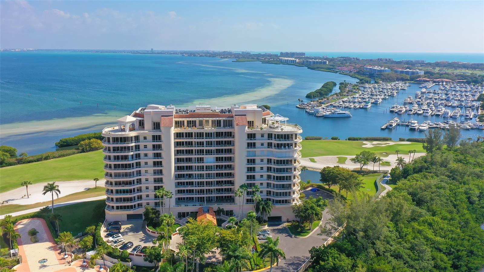 One or more photo(s) has been virtually staged. Set high in the coveted Grand Bay IV community on Longboat Key, just one floor below the penthouse, this 2,550-sq.-ft. Cayman floor plan offers an extraordinary opportunity to craft your bespoke retreat. With two prime side-by-side parking spaces conveniently located on the upper main floor next to the elevator, you’ll step effortlessly into your private elevator foyer—an inviting entry to a space ready for transformation, a blank canvas to bring your unique vision to life. Perfectly positioned with north-south exposure, this residence captures both breathtaking sunrises over Sarasota Bay and stunning Gulf sunsets from its two expansive terraces. Walls of glass and an abundance of windows invite natural light throughout, enhancing the open-concept layout. The residence includes 3BR/3.5BA, with a den that can be easily combined to include a walk-in closet. The den, kitchen and 3rd bedroom share a balcony with floor-to-ceiling glass, creating a seamless indoor-outdoor connection. The primary suite enjoys direct access to the terrace, while the 2nd bedroom boasts an en-suite bath and its own private balcony with dazzling Gulf views. Residents of Grand Bay enjoy first-class amenities at their doorstep, including a 24-hour guard gate, secure under-building parking, a clubhouse with a library and game room, a fitness center, multiple tennis and pickleball courts, two heated pools and a spa. Deeded access to the private beach and miles of walking paths are nearby. Membership in the exclusive Bay Isles Beach Club is included.
