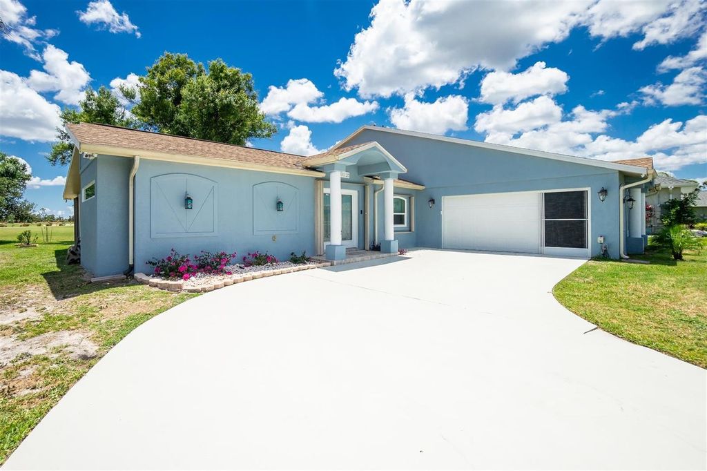 Photo of 12001 SW Kingsway Circle, Lake Suzy, FL 34269 (MLS # OM701608)