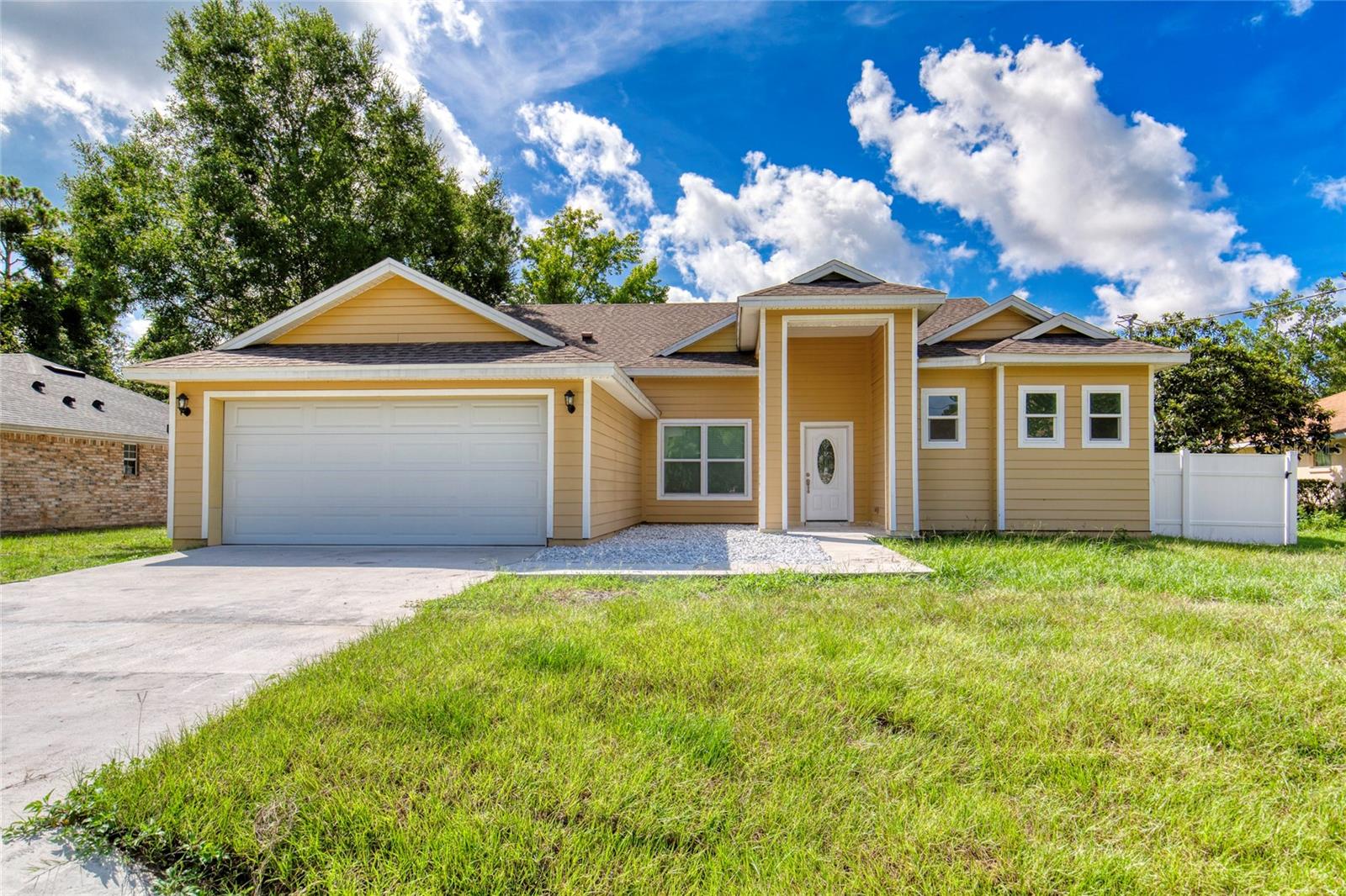 This newly remodeled 3-bedroom, 3-bathroom home in the desirable Pine Lakes subdivision is move-in ready and designed with modern living in mind. Step inside to find 30'' x 30'' porcelain tile floors throughout, a split floor plan offering privacy and function, and a stunning chef's kitchen with quartz countertops that carry through to the bathrooms. The spacious primary suite features elegant tray ceilings, a large walk-in closet, and a spa-like bathroom with dual vanities, a glass-enclosed shower, and a luxurious stand-alone soaking tub. Enjoy seamless indoor-outdoor living with sliding glass doors leading to a deep, covered veranda, complete with its own full outdoor bathroom—perfect for entertaining. The backyard is fully enclosed with a 6' white vinyl privacy fence and offers ample space for a future in-ground pool. Located just moments from Pine Lakes Golf Club, residents can also take advantage of the area's many trails for biking, jogging, and skating. With a brand new roof, hot water heater, and HVAC, this home is turn key ready.
All information entered in the MLS in intended to be 100% accurate but cannot be guaranteed.