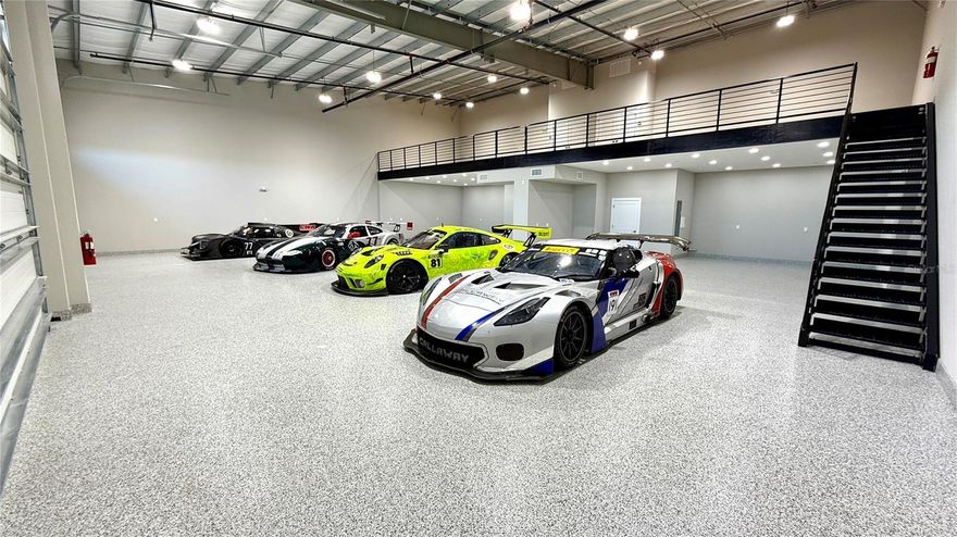 BE PART OF IT! Sebring Motor Garages is a new 150-unit race-inspired condominium garage community located just three minutes to the famed Sebring International Raceway in Sebring, Florida. In addition to the 69 units that are complete, there is also a 3,000 SF race inspired clubhouse with heated pool. The Clubhouse includes an indoor/outdoor bar, race simulators, four flat screen TV's, game tables and meeting rooms. All units are delivered move-in ready with full bathroom (including shower), air conditioning, fire suppression system, three-phase electric, mezzanine and stairs. Mezzanine heights are either 10' or 14' high (for motor homes). The units include primed walls, sealed concrete floor and floor covering in mezzanine. Units can be fully customizable. Unit sizes are 25' x 55' and 30' x 55'. Double units are also available with sizes of 50' x 55'  and 60' x 55'. All units include a personnel door and 14’ tall overhead doors with widths ranging from 14' wide or 16' wide, allowing for large rigs, motorhomes and lifts. There will also be a 3,300 SF onsite race garage owned and operated by Charles Wicht Racing to provide race tech services to our community racers. There is a 24/7 dedicated parcel room and full-time daily concierge staff to assist members with any needs. This community will be very social and is not just for racers but also those with a passion for their toys including motorcycle and car collections or boats and RV's. Member-only and public events are planned offering social and networking opportunities for all. Low HOA fees of +/- $300/month. 

Apex Motor Garages, LLC, the developer, is also constructing the adjacent 24 unit 3-story townhome project comprised of 4,590 total SF each with private elevator. See MLS#L4952695 for more information on the townhomes.