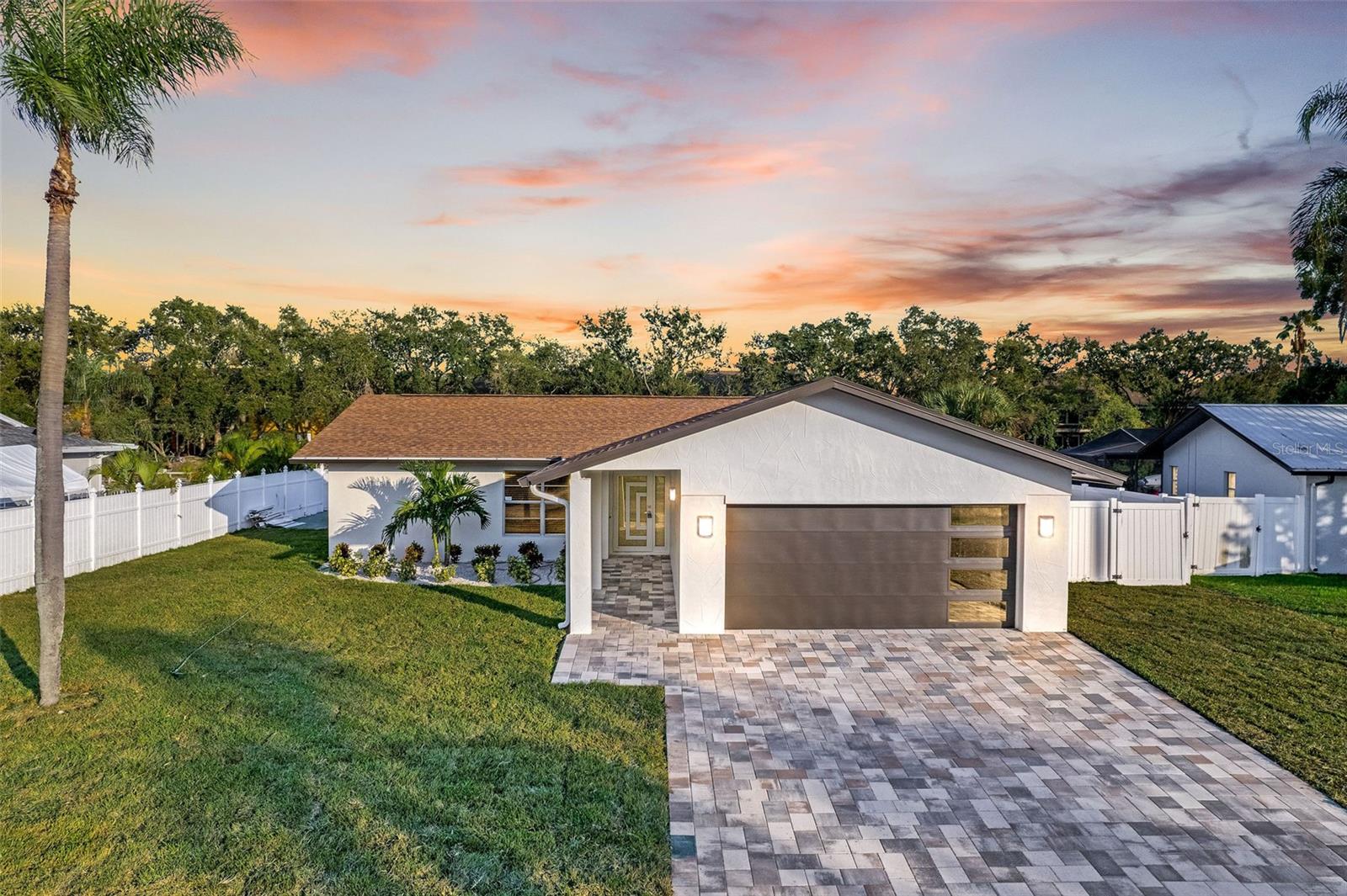 Stunning fully remodeled waterfront home with direct Gulf access and a brand-new seawall! This move-in ready property has been thoughtfully updated inside and out. Exterior upgrades include fresh paint, new sod, upgraded doors, and beautiful paver accents that elevate curb appeal. Step inside to find new porcelain tile flooring throughout, a gourmet kitchen with upgraded quartz countertops, and a fully redesigned bathroom with quartz and designer tile. Every detail, from the interior and exterior doors to the finishing touches, has been refreshed to create a stylish coastal retreat. Enjoy Florida living at its finest with boating, fishing, and sunset cruises right from your backyard.