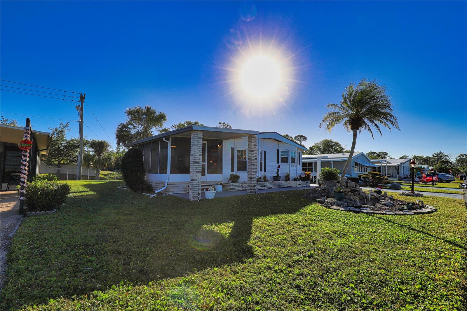 This is your chance to live the La Casa Lifestyle in Paradise! From the stunning landscape to the charming interior with lots of unique touches, this home invites you in and makes you want to stay. You’ll enter into a large laundry room with a small storage closet and a built-in desk. The kitchen/ dining room combination is perfect for dinner parties and has a built-in hutch for extra storage. The living room is spacious with lots of natural light and Berber carpet and has a glass built-in for a display center. This room opens to a large Florida Room with a tile floor which will make a great area for entertaining friends and family. The Primary bedroom is extremely roomy with a walk-in as well as a wall closet and has an ensuite bathroom that features a copper bowl sink. The guest bedroom is a comfortable size with a walk-in closet and the guest bath right across the hall. Home is being offered turnkey, and as it’s located in the
pet area so your furry friend will enjoy paradise too! New garbage disposal 2024, vinyl skirting 2024, new shingle roof 2023, new hot water heater 2023, updated bathrooms 2023, new screening on lanai 2023, A/C 20018. La Casa boasts 974 homes nestled among a variety of native trees with spacious common grounds surrounding our eight lakes. Our lots average a generous 60' by 80'. The ultimate lifestyle on Florida’s Gulf Coast is located between Sarasota and Fort Myers and is a boater's dream with access to the Gulf of Mexico. It is convenient for shopping, sightseeing, golfing, fishing, and boating, as well as all the culture and elegance the Southwest Florida area is noted for. Residents and visitors enjoy the warmth of Southwest Florida winters in a relaxed and unhurried environment far removed from the hustle of Florida’s east coast. You’ll be surrounded by mature lush landscaping which demonstrates the utmost level of care our property receives from residents and management. La Casa may have the best pools in the area. Our crown jewel is an extremely large, 40 X 60-foot swimming pool that is kept at a perfect 87 degrees. Our smaller 20 x 40 pool is quietly nestled between the clubhouse and the Activity Building. Both pools have adjacent hot tubs which are ideal for soaking muscles that are tired from golfing or tennis. Wireless Internet (Wi-Fi) is available at the Clubhouse, Activity Building, and Recreation Hall area where these pools & spas are located, so you can catch some rays while you catch up on your email! Sound enticing? La Casa is a friendly, family community. You will be away from the hustle and bustle except when you want to be part of it. Come for a visit to this self-contained oasis and see for yourself why La Casa is the ultimate destination for both snowbirds and year-round residents!