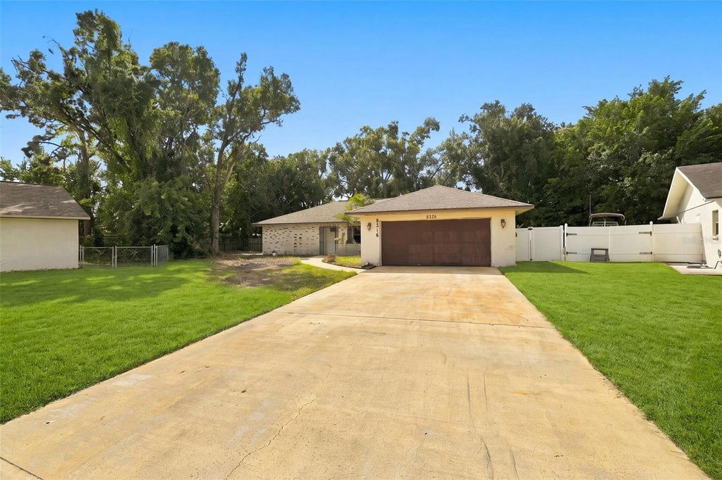 Photo of 8326 Sylvan Woods Drive, Sarasota, FL 34243 (MLS # TB8558685)