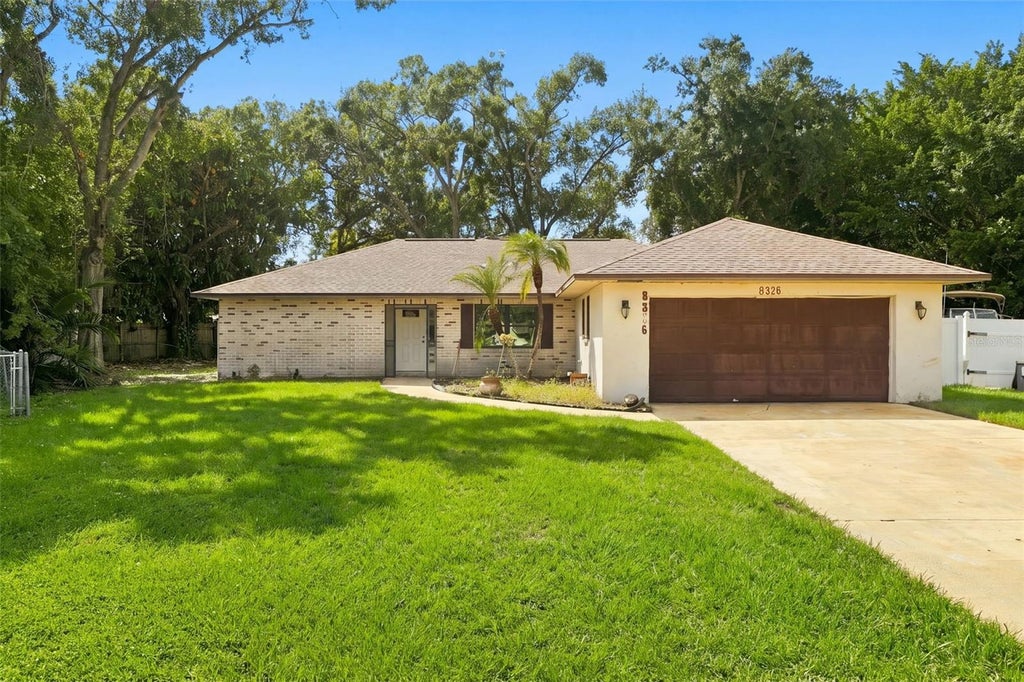 Photo of 8326 Sylvan Woods Drive, Sarasota, FL 34243 (MLS # TB8558685)