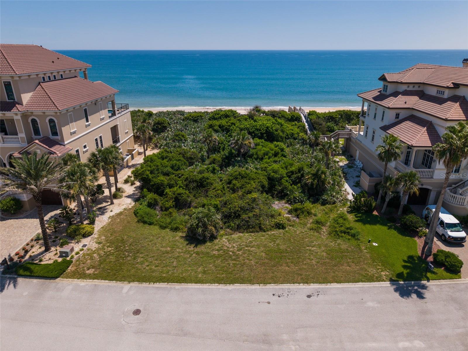 This spectacular home site is located in the exclusive gated oceanfront golf community of Hammock Dunes. Featuring 100 feet of direct oceanfront and spectacular views of Lake San Gabriel. No timeframe to build. An opportunity awaits to start building your oceanfront dream home and living the Hammock lifestyle. To further elevate the Hammock Dunes® Oceanfront Community lifestyle, purchasing a Hammock Dunes Club Membership is available. The Club is honored to have been selected “Distinguished Emerald Club of the World” and locally tapped by Orlando Style Magazine as #1 Reader’s Choice Award for Best Club in the Southeast offering its members, their families and guests a superior member experience and features an Oceanfront Clubhouse, fabulous Formal and Casual Dining, 2 magnificent Audubon-certified Golf Courses by legendary designers Tom Fazio and Rees Jones, new 5,000 sf Fitness Center with ocean views, Oceanfront Swimming Complex, Tennis Center, Croquet and MORE!