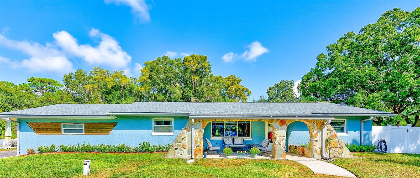 Showcasing Stunning Coastal Farmhouse situated in the heart of Odessa.  Meticulously cared for updated block construction home on a spacious 0.29 acre lot without any flood issues!  The backyard has abundance of space for family and friends.  Fully vinyl fenced backyard, expansive paver patio surrounding a refreshing pool.  Dog run or chicken coop,  raised garden bed, and brand new 12x12 shed all add to fantastic outdoor living.  However, you may want to add your own touch.... outdoor kitchen, huge firepit area, shuffleboard ct. possibilities are endless!  Step inside to an open concept fully updated with porcelain tile for durability and elegance.  Barn doors on the walk in pantry and guest bath add to the farmhouse feel along with the cozy fireplace to gather around on a chilly winter evening.  The kitchen has quartz countertops and soft close solid wood cabintry.  Stainless steel appliances and a shiplap island is great for entertaining.
Split bedroom layout provides comfort and privacy.  New carpet in 2022 in bedrooms, also featuring a 7x13 wardrobe lovers retreat in the primary bedroom! All appliances and washer and dryer are included.  New roof, exterior and interior paint 2022.  No HOA, a turn key home on a hard to find spacious lot located in Odessa with top rated schools, parks, shopping, and dining.