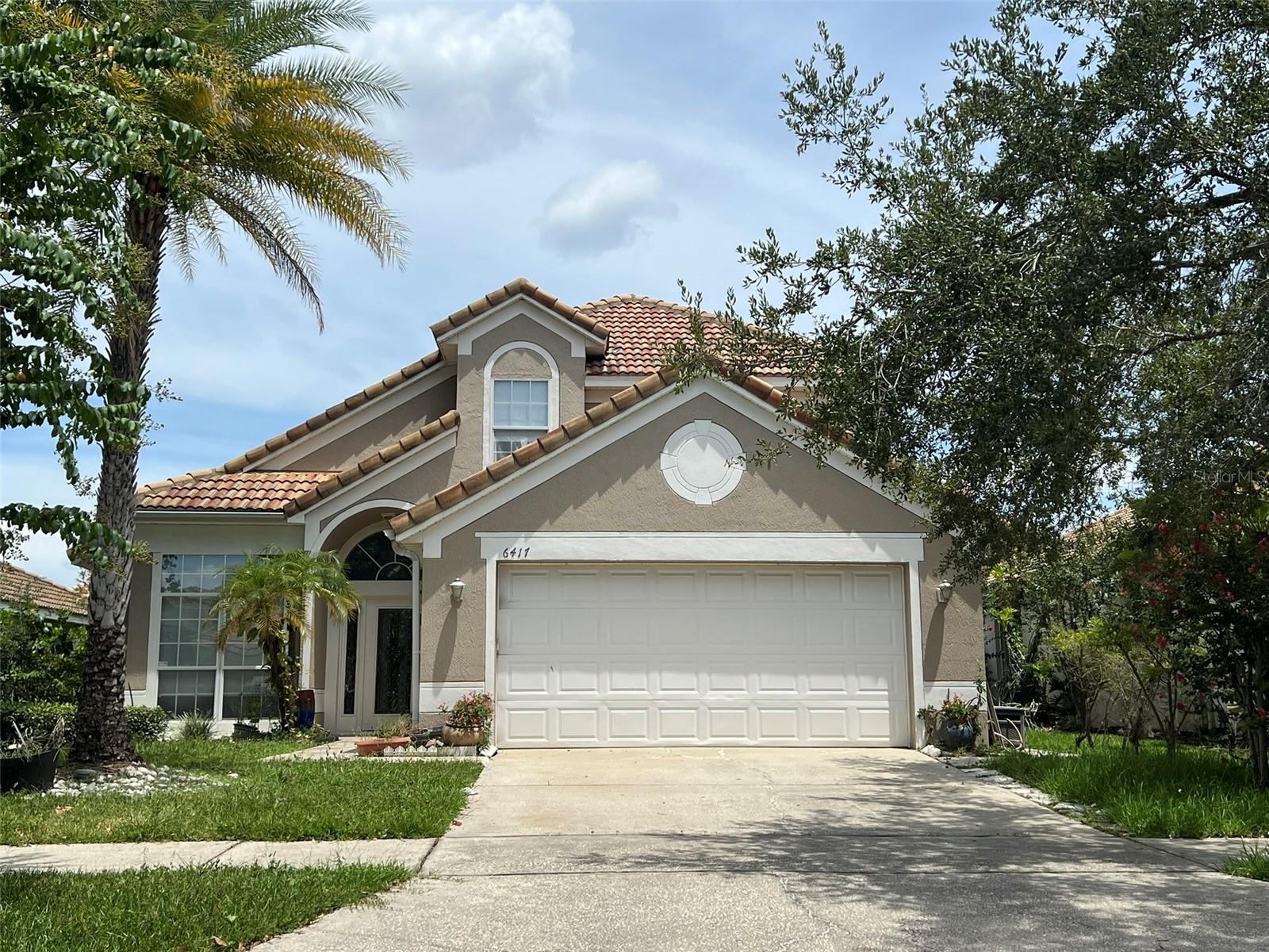Discover refined living in this elegant 3-bedroom, 2.5-bath residence located in the sought-after Winder Oaks community. Designed with comfort and style in mind, this home features soaring ceilings, expansive living spaces, and oversized windows that flood the interior with natural light. The gourmet kitchen offers abundant cabinetry, a breakfast bar, and a cozy nook for morning coffee. The primary suite on the first floor is a true retreat with a spa-inspired bath, dual vanities, a soaking tub, a separate shower and a custom-made walking closet. Step outside to your covered patio overlooking a private, landscaped backyard—perfect for quiet evenings or entertaining guests. With a 2-car garage, modern finishes, and a prime location just minutes from Restaurant Row, Universal Orlando, and upscale shopping, this home offers the perfect balance of elegance and convenience.