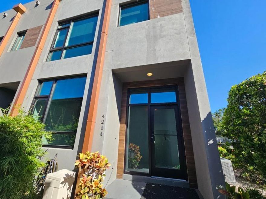 Nice End Unit Townhome with 3 Bedrooms 3 Bathrooms w/Private Garage & Carport Plus Private Rooftop Deck Located in the Quiet Gated Gauge Line Lofts Community. Home has an open layout with engineered hardwood floors throughout the first floor, floor-to-ceiling hurricane-rated windows, exposed steel beams and an open tread staircase. The Gourmet kitchen features Quartz countertops, 42" cabinets, and stainless-steel appliances including the dishwasher, range w/range hood and built-in microwave drawer. Primary bedroom suite has a walk-in closet with a private bathroom featuring dual sinks and a separate shower. Home features exceptional finishes with over $70K of upgrades as it was the original model home to include designer light fixtures, custom blinds, custom closet systems in every closet, a laundry area, surround sound on all 3 levels, a loft area (second floor), a steel spiral staircase to rooftop and so much more. Exterior patio features trek decking and offers plenty of space to cookout and entertain family and friends while the rooftop deck offers a wonderful space to relax with a firepit table and nice views of the city. Community is private, gated and features a community swimming pool. Location is perfect just minutes from the heart of Carrollwood and everything else including shopping, restaurants, entertainment, schools, Downtown Tampa, the Tampa International Airport and all the expressways. Please call to schedule a showing today!