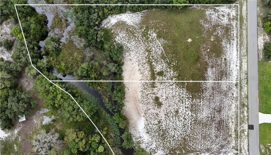 Welcome to Lake Reedy Estates, an exclusive gated community offering peace, privacy, and access to one of Florida’s most beautiful lakes. This high and dry 2.42-acre parcel of buildable land is a rare find, featuring deeded lake access with a private community dock—perfect for boating, fishing, or simply soaking in the serene water views. Reedy Creek flows gracefully through the property, adding natural charm and attracting an abundance of local wildlife. Lake Reedy itself spans nearly 3,500 acres and is renowned for its excellent bass fishing, clear waters, and stunning sunrise views. With ample space to design and build your dream home, this property offers the perfect blend of tranquility, natural beauty, and recreation in a highly desirable location.