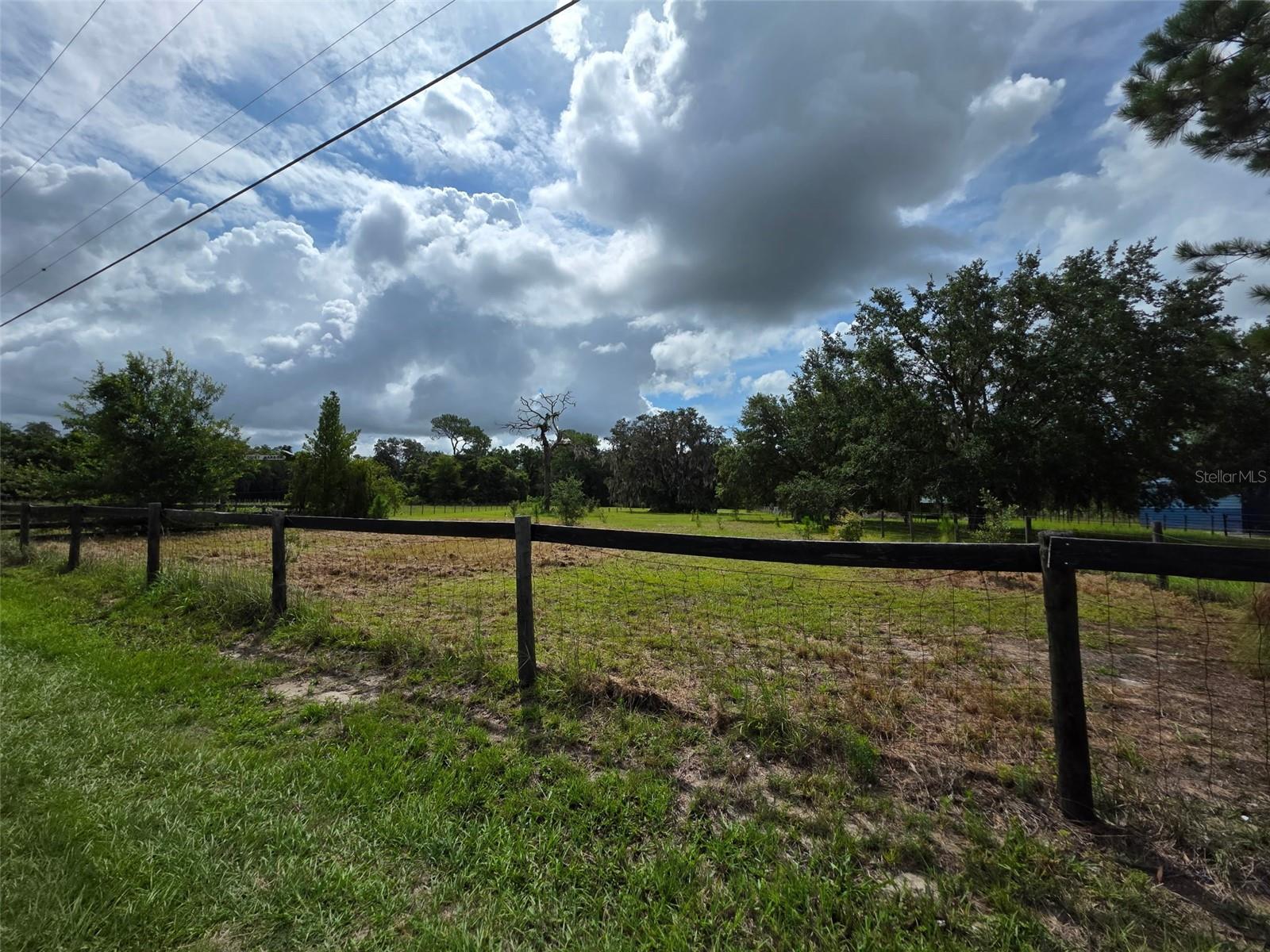 Discover 5+ peaceful acres of opportunity in scenic Weirsdale. This beautiful parcel offers open, cleared land with agricultural zoning—perfect for building your dream home, starting a hobby farm, or bringing your horses. Located on SE Hwy 42 with paved road frontage and nearby utilities, this property combines rural charm with accessibility. Just minutes from The Villages, Lake Weir, and Ocklawaha, enjoy privacy without sacrificing convenience. No HOA, no deed restrictions—just pure Florida freedom.