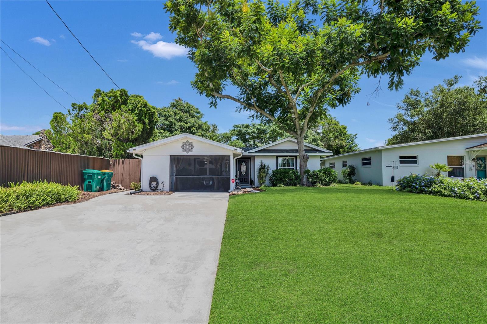 PRICE IMPROVEMENT! Step into timeless charm with this beautifully remodeled 3-bedroom, 2-bath home that seamlessly blends classic character with modern convenience. From the inviting new front porch, you can unwind and enjoy peaceful sunsets in a setting that feels both cozy and refined. Thoughtfully updated throughout, the home features a new roof, new AC with surge protection, new tankless water heater, new irrigation system with surge protection, updated electrical panel, and brand-new attic insulation—giving buyers peace of mind and energy efficiency. Step outside to your fully fenced backyard oasis, complete with a beautifully appointed gazebo area, perfect for outdoor lounging or entertaining. Surrounded by mature landscaping and enhanced with charming touches like potted plants and cozy seating, the outdoor space extends your living area and makes this home feel like a retreat. Located less than 10 minutes from the Mount Dora Historic District and just minutes from grocery stores, restaurants, and schools, this home offers the ideal blend of charm and accessibility in the heart of Eustis. Perfect for buyers seeking a move-in-ready home with vintage appeal and modern upgrades, this one won’t be around for long.