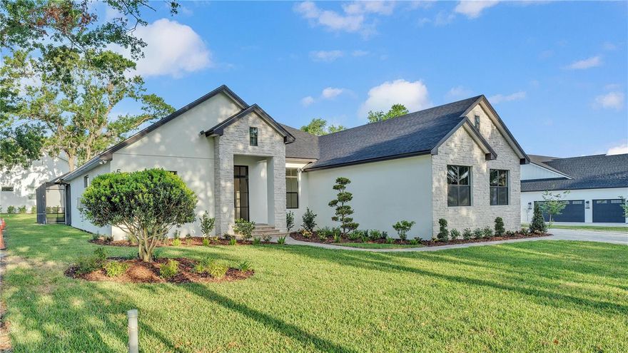 Gorgeous, brand new South Lakeland home! Located in a peaceful, wooded lot setting across the street from Little Banana Lake. Open, spacious split floor plan with wood beam ceilings in great room, stunning Cantera front door, electric fireplace with stone accents, and wood tile floors throughout entire home! The kitchen features Shaker-style cabinets, hood vent, upgraded GE-Cafe appliances with gas cook top, wine cooler, microwave drawer, double oven, and beautiful Taj Mahal quartzite counter tops! Gas tankless water heater, & outdoor kitchen grill! Screened pool with hot tub, electric pool heater, and paver pool deck! Tongue & groove porch ceilings! The 5th bedroom can serve as a game room or in-law suite. No HOA. Top quality home tastefully designed with the assistance of an interior designer! Built by Tapia Construction. Builder's one year warranty applies. Agent/Owner.