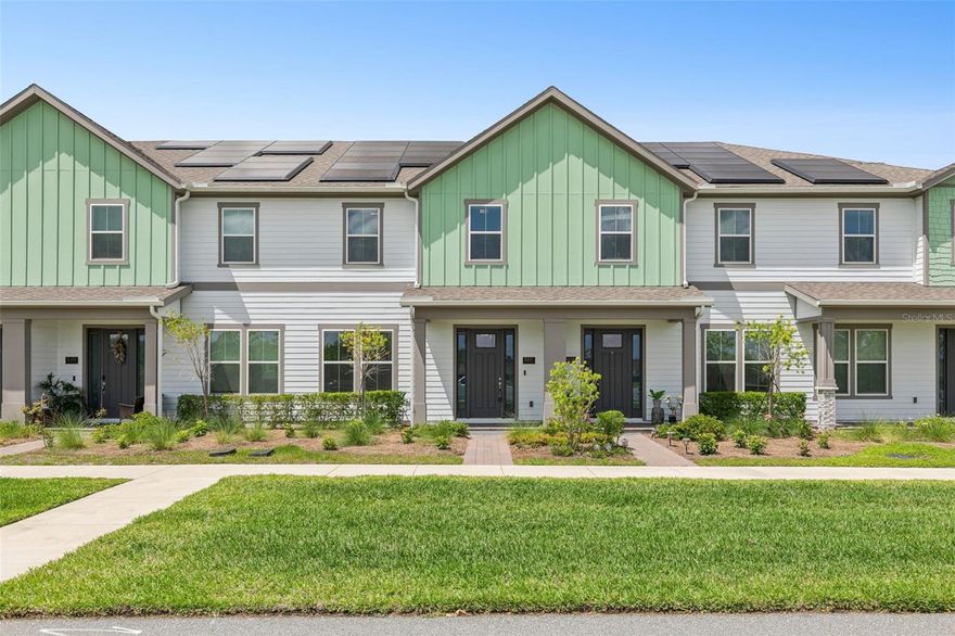 One or more photo(s) has been virtually staged. Priced well below market value and offering $10,000 toward buyer’s closing costs, this is an opportunity you don’t want to miss. Welcome to this beautifully maintained 3-bedroom, 3-bathroom townhome located in the desirable Weslyn Park community, just minutes from Lake Nona. This modern residence features an open-concept layout designed for both comfortable living and effortless entertaining. The spacious main living area showcases porcelain wood-look tile flooring and abundant natural light, seamlessly connecting the living, dining, and kitchen spaces. The kitchen is thoughtfully designed with 42-inch cabinets, quartz countertops, stainless steel appliances, a built-in microwave and oven, and a large island that is perfect for casual dining. Just off the 2-car garage, you’ll find a convenient mudroom entry, providing added functionality and organization for everyday living. Upstairs, the primary suite features an en suite bathroom with a double sink vanity and a walk-in shower with a glass enclosure, while the two remaining bedrooms are generously sized and offer flexibility for guests, a home office, or a growing household. Additional highlights include paid-off solar panels, keeping the electric bill at approximately $30 per month and delivering impressive energy efficiency and long-term savings. Residents enjoy access to resort-style amenities, including parks, trails, and a community pool. Conveniently located near Lake Nona, this home offers easy access to shopping, dining, entertainment, and major roadways.