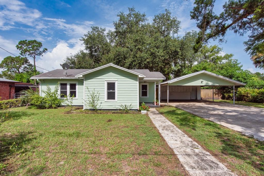 Charming, Updated, and Packed with Potential in Plant City! Tucked away on just over a ¼ acre, this thoughtfully updated 2-bedroom, 1-bathroom home offers comfort, space, and functionality—all in a cozy 872 sq. ft. layout that lives much larger than its size suggests. Step inside to find vinyl flooring flowing throughout the entire home, creating a clean and cohesive look. The kitchen features an inviting eat-in area, solid wood cabinetry, updated Formica countertops, and sleek stainless-steel appliances, blending classic touches with modern convenience. The bathroom is well-appointed with a tub/shower combo and two linen closets for optimal storage. The oversized master closet is a rare bonus, and an extra hallway workspace adds versatility for a home office or hobby station. You'll also find a laundry room and a storage room, providing even more room to keep everything organized. For added practicality, there's interior attic access offering yet another generous storage option. Recent improvements include updated windows, a new electrical panel, and complete rewiring of the kitchen and bathroom. Plumbing has been updated with a combination of copper and PEX, giving peace of mind for years to come. Step outside to a fully fenced backyard, ideal for pets, gardening, or weekend gatherings. A large detached 2-car carport offers covered parking and features additional storage cabinets and a newer tin roof, perfect for protecting your vehicles and tools from the elements. Whether you're a first-time buyer, looking to downsize, or seeking a move-in-ready home with room to grow—this one checks all the boxes. Come experience the charm and value this Plant City gem has to offer! Call now!