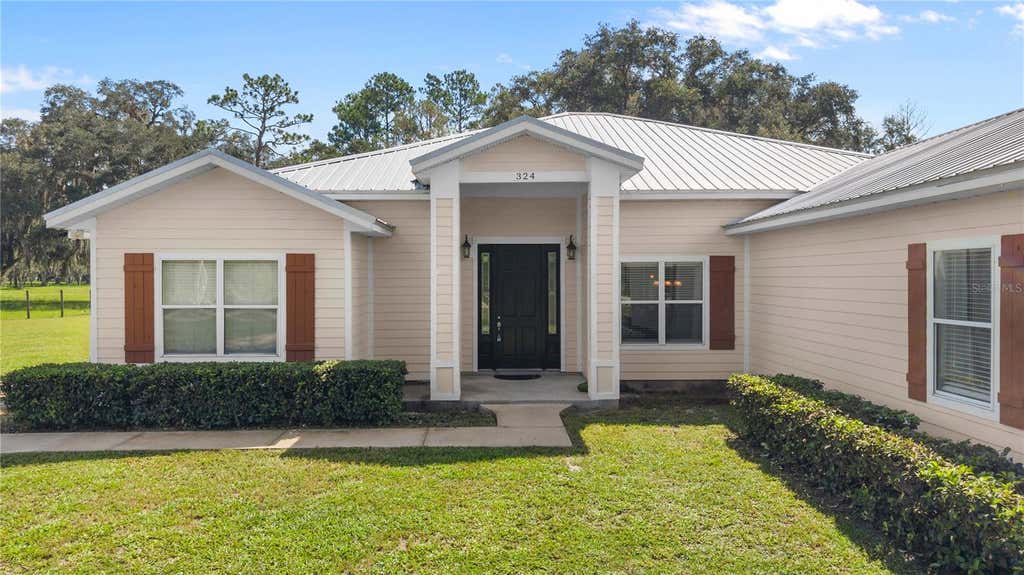 Photo of 324 NE 300th Street, Cross City, FL 32628 (MLS # W7888812)