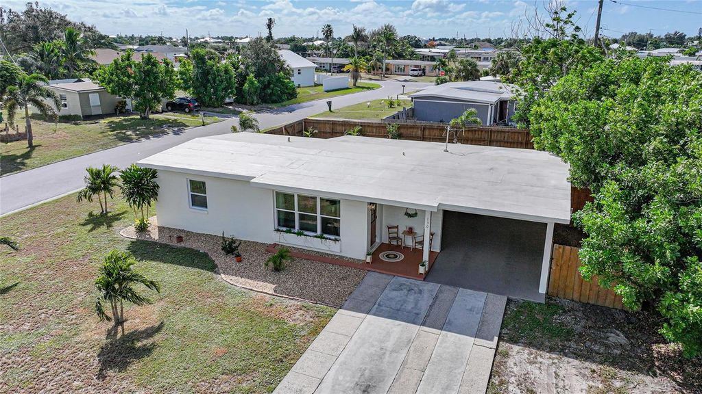 Photo of 130 Palmetto Circle NE, Port Charlotte, FL 33952 (MLS # C7516872)