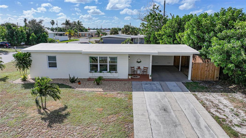 Photo of 130 Palmetto Circle NE, Port Charlotte, FL 33952 (MLS # C7516872)