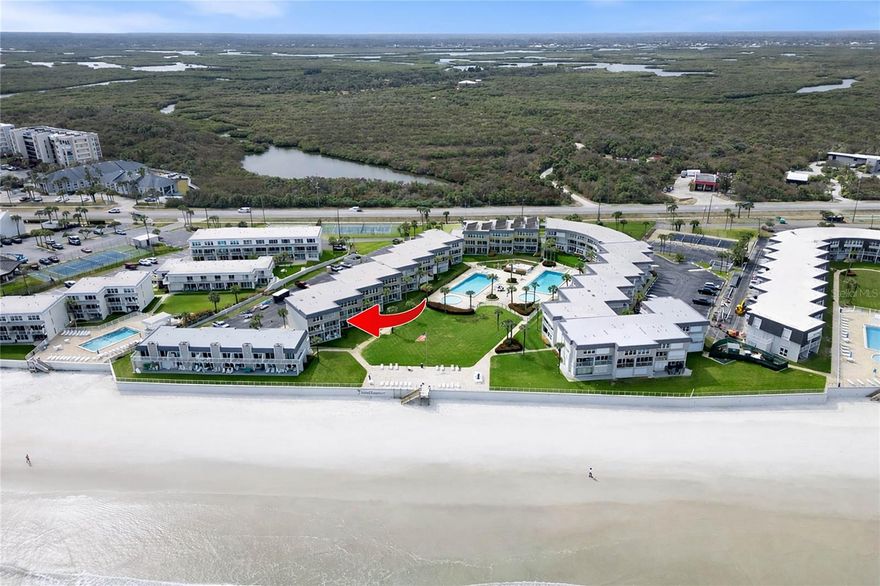 HOW CLOSE CAN YOU BEACH!?!?  Fully Renovated, Direct Ocean Front 2/2 on NSB's coveted No-Drive Beach. A unique Turn Key opportunity. You'll never want to leave this beautifully renovated and furnished beach pad with FULL OCEAN and BEACH VIEWS. This residence is located on the 2nd and 3rd floors of the "B" Bldg., and is the Eastern most unit in Bldg. B. Downstairs features a beautifully renovated kitchen with full ocean views, wood cabinets, quartz counter tops, custom tile backsplash, stainless appliances and a deep under-mounted stainless sink. Enjoy the Open Floor Plan in the adjacent Great Room that includes both living and dining areas. The welcoming coastal vibe invites you to immediately decompress and soak in the Beach Lifestyle. The great room opens onto the ocean front balcony offering you sunrises and afternoon shade. Downstairs you also find a beautiful, fully renovated full bathroom with walk-in shower featuring custom tile work and glass enclosure. Upstairs you'll find a spacious ocean front Primary bedroom with King Bed, a very large guest room that comfortably sleeps four. Upstairs you'll also appreciate having a washer and dryer easily accessible. For "Lock and Leave" security and peace of mind, this home enjoys impact windows and sliders and motorized storm shutters. The Southeaster complex is a five acre property with lush, tropical landscaping, large lawns, two swimming pools (one of which is heated seasonally), two kiddie pools, tennis courts, shuffle board court, an oceanfront patio, recreation room, owners storage, Large Community Laundry Room, Bike Room and an on-site rental and management office. It's going to be tough to find anything closer to the beach than this. Please check out the photos and virtual tour to fully appreciate this unique property. All measurements are approximate, and Buyer is responsible for verifying all dimensions.