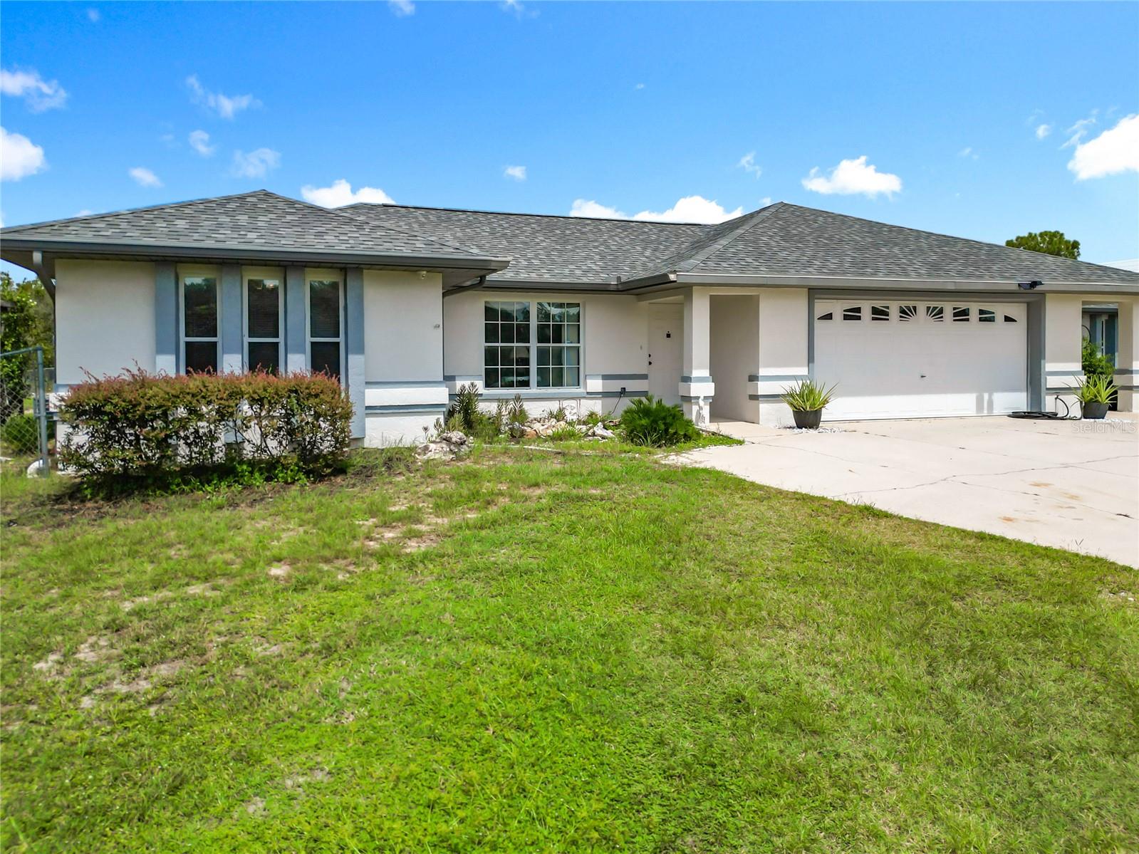 Discover a property that truly has it all — 2.48 fully fenced acres in Rainbow Lakes Estates with a main home, guest house, pool, and a workshop built to impress.
The 3-bedroom, 2-bath main home welcomes you with a bright open layout, a cozy gas fireplace in the living room, and a spacious master suite complete with a walk-in closet. The separate guest house offers 2 bedrooms, 1.5 baths, a full kitchen, private patio overlooking the pool, and its own master suite with a walk-in closet — perfect for extended family or friends.
Step outside to enjoy your sparkling in-ground pool, cleared acreage ready for gardening or recreation, and a separately fenced area designed for pets. Car enthusiasts and hobbyists will be amazed by the 4,000+ sq. ft. workshop featuring a lift, oversized bays, and storage for RVs, boats, or equipment. There’s even a small unfinished apartment with endless potential as an office, studio, or bonus guest space.
Living in Rainbow Lakes Estates means more than just a home — you’ll also have access to a clubhouse, parks, playgrounds, tennis and basketball courts, racquetball, softball fields, walking trails, picnic pavilions, and community lake access for fishing and boating.
With multiple covered parking pads, an RV garage, no HOA, and unmatched versatility, this property is ready to fit your lifestyle. Schedule your private showing today!