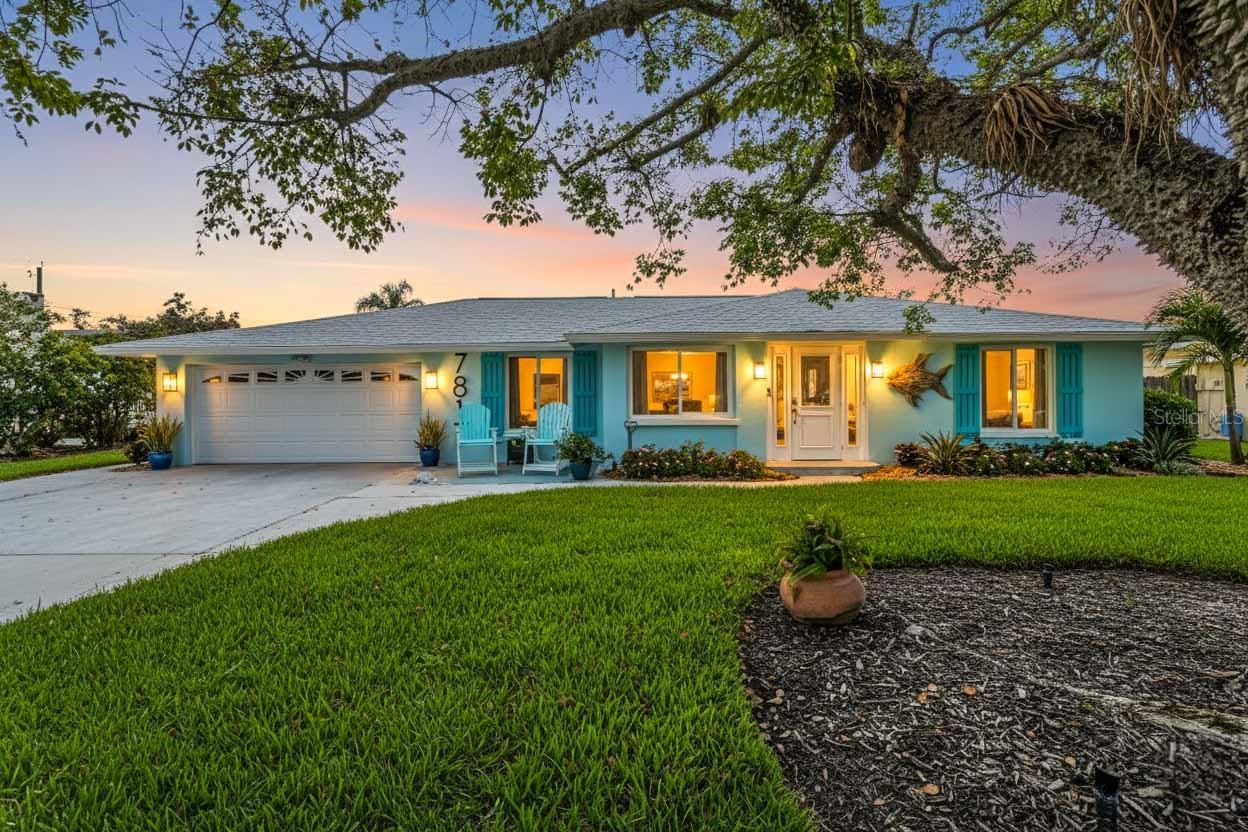 Welcome to your personal tropical retreat in the heart of Palma Sola Park—one of Bradenton’s most beloved waterfront communities. This beautifully updated 2-bedroom, 2-bath, 2-car garage coastal home blends laid-back luxury with thoughtful upgrades and a lifestyle that’s truly unmatched. From the moment you arrive, you’ll be drawn to the newly completed pool and patio deck (2024), designed as a true outdoor oasis. The pool features brand-new coping, tile, and all-new equipment, including a salt cell, heat and cool pump, filter, and skimmer—all installed in 2023. The highlight of the backyard is the incredible custom-built Tiki Bar (2023), crafted with real palm fronds and designed to entertain. Seating up to 12 guests comfortably, the bar is fully equipped with electric, air cooling, and a mounted TV, creating a year-round resort-style experience right in your own backyard.
Inside, the home continues to impress with clean coastal finishes and modern functionality. The kitchen is bright and welcoming, with white cabinetry, quartz countertops, stainless steel appliances, and convenient slide-out pantry drawers. A built-in banquette offers the perfect casual dining spot, in addition to a more formal dining area. Both bathrooms are updated with quartz countertops and coastal-inspired cabinetry, including charming manatee cabinet knobs that add a playful touch. Storage is abundant throughout thanks to custom California Closets, and peace of mind comes easy with all-new plumbing (2023), a new roof (2022), and impact-resistant windows and sliding glass doors that let the natural light pour in.
Outside your door, Palma Sola Park offers a rare combination of natural beauty, community connection, and freedom—with no HOA restrictions. The neighborhood is golf-cart friendly and rich with character, where you’ll often see neighbors walking pets, fishing at the basin, or gathering to watch the sunset over Palma Sola Bay. Residents have optional access to a private marina and club, and the community hosts monthly events, outdoor movies, yoga, and more in its five welcoming parks. Whether you're looking for a peaceful full-time residence, a weekend getaway, or a savvy investment property, this home offers it all—just 5.5 miles from the sugar-sand beaches of Anna Maria Island.
This isn’t just a home—it’s a turnkey coastal lifestyle. Come see it for yourself. Your waterfront sanctuary awaits.