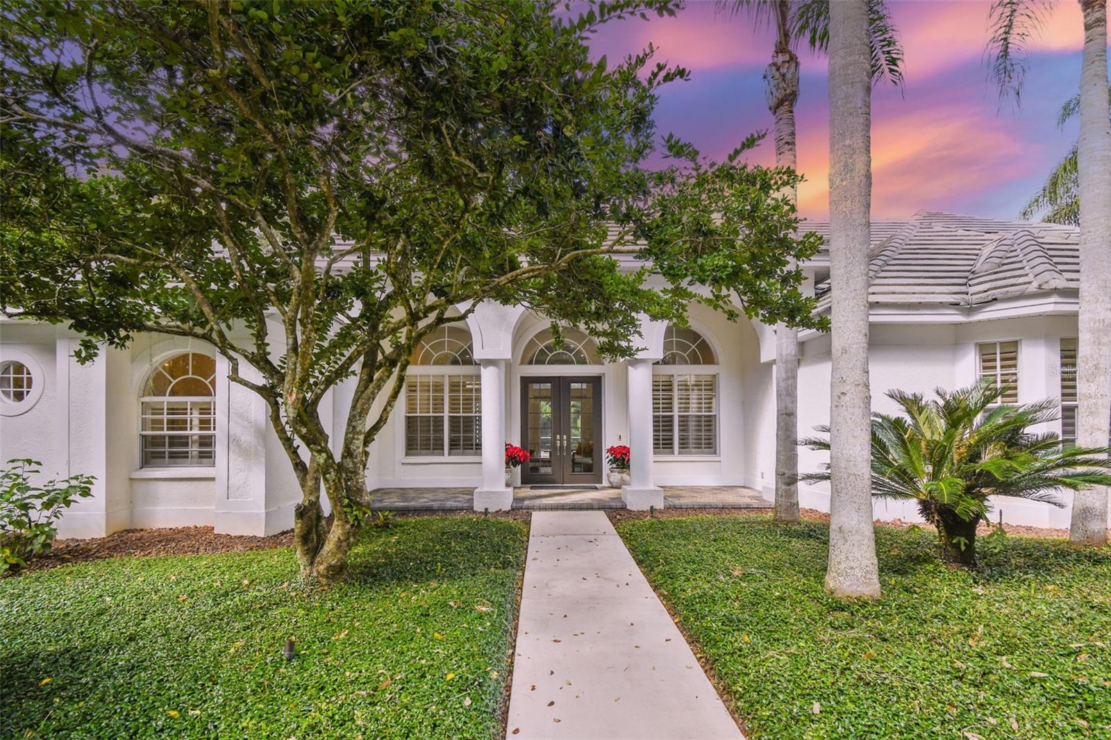 Welcome to this beautiful one-story block and stucco home in Avila, a 24 hour guard gated, country club community in which the Club offers golf on a masterful Jack Nicklaus designed course, six Har-Tru tennis courts, junior Olympic pool, gym, and delicious dining at the clubhouse or for delivery. This appealing home is extremely convenient to the Avila park and playground and includes a large wooded area. This, combined with a tastefully landscaped yard, provides the ideal setting. The gorgeous split design home boasts an open floor plan, which includes 4 bedrooms, 3-1/2 bathrooms, and 3,512 square feet of air conditioned living space with scenic views of the tropical backyard and screened pool area. The gourmet kitchen has granite counters with a stainless steel topped island. The kitchen and breakfast area open to the spacious family room, which centers on a fireplace and has pocketing sliders. Twelve foot ceilings with clerestory windows at living, dining, family and kitchen, cement tile roof, wood floors throughout, sitting area in master retreat, oversized master bath with separate shower and jetted soaking tub, huge office, new LED recessed can lights and a 3 car side facing garage are but a few of the features distinguishing this outstanding home.