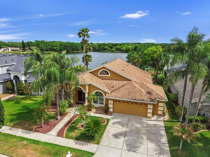 One or more photo(s) has been virtually staged. (SOME PICUTURES ARE STAGED) LAKEFRONT HOME WITH AN EXPANDED VIEW OF HICKORY HAMMOCK LAKE (14.5 ACRES) BEAUTIFUL 4 BEDRROM 3 BATH SPLIT PLAN WITH AN ECCEPTIONAL CHEF KITCHEN,  2 CAR GARAGE IN THE WELL MAINTAINED COMMUNITY OF HICKORY LAKES PHASE 2, A SCREEN AND PAVED LANAI.  THE LAKE IS FRIENDLY TO LAUNCH KAYEKS/CANOES AND  FISH.  THERE IS PLENY OF SPACE  IN THE BACK YARD TO BUILD YOUR OWN SWIMMING POOL.