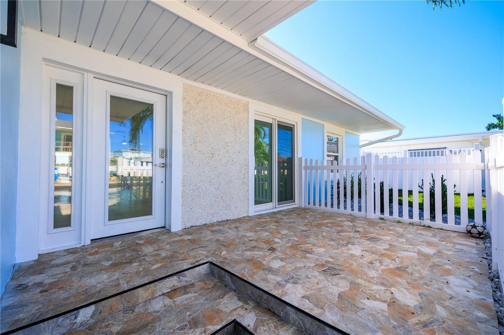 Photo of 730 Pruitt Drive, Madeira Beach, FL 33708 (MLS # TB8558873)