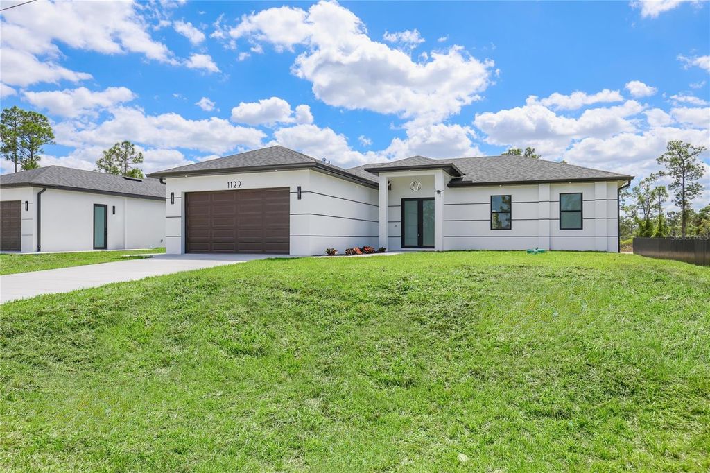 Photo of 1122 S Edelweiss Street E, Lehigh Acres, FL 33974 (MLS # C7524162)