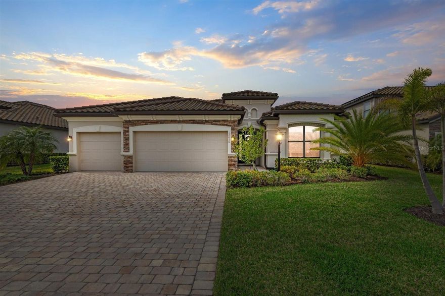 Experience the ultimate backyard paradise in this 4-bedroom, 2-bath home in Polo Run, Lakewood Ranch’s only solar-powered gated community. Spanning 2,268 sq. ft., this home seamlessly blends modern elegance with eco-friendly living—but it’s the outdoor space that truly steals the show. Step outside to your private resort-style oasis, where a custom saltwater pool glistens against the backdrop of one of the largest lakes in Lakewood Ranch. The expansive travertine lanai offers unmatched privacy, creating the perfect setting for relaxation and entertainment. Host unforgettable gatherings in the fully equipped outdoor kitchen, then unwind as you take in spectacular sunsets over the water. Inside, the open-concept layout features a gourmet kitchen with granite countertops and a spacious island, flowing effortlessly into the living and dining areas. The primary suite is a serene retreat with a spa-like en-suite bath and a generous walk-in closet. Polo Run offers resort-style amenities, including a heated pool, fitness center, tennis, pickleball, basketball, playground, clubhouse, and dog park. Just minutes from Waterside Place, UTC, golf courses, and world-class beaches, this home offers the ultimate Florida lifestyle. Don’t miss this rare opportunity—schedule your private showing today!
