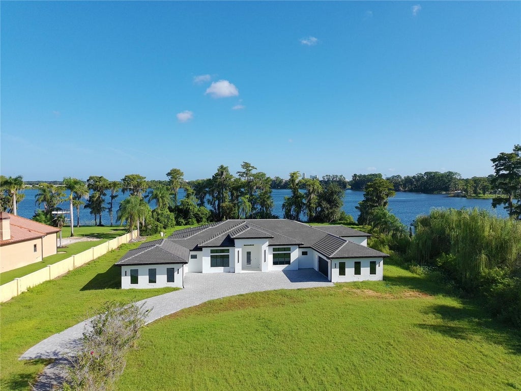 Photo of 7240 Lake Willis Dr, Orlando, FL 32821 (MLS # O6444340)