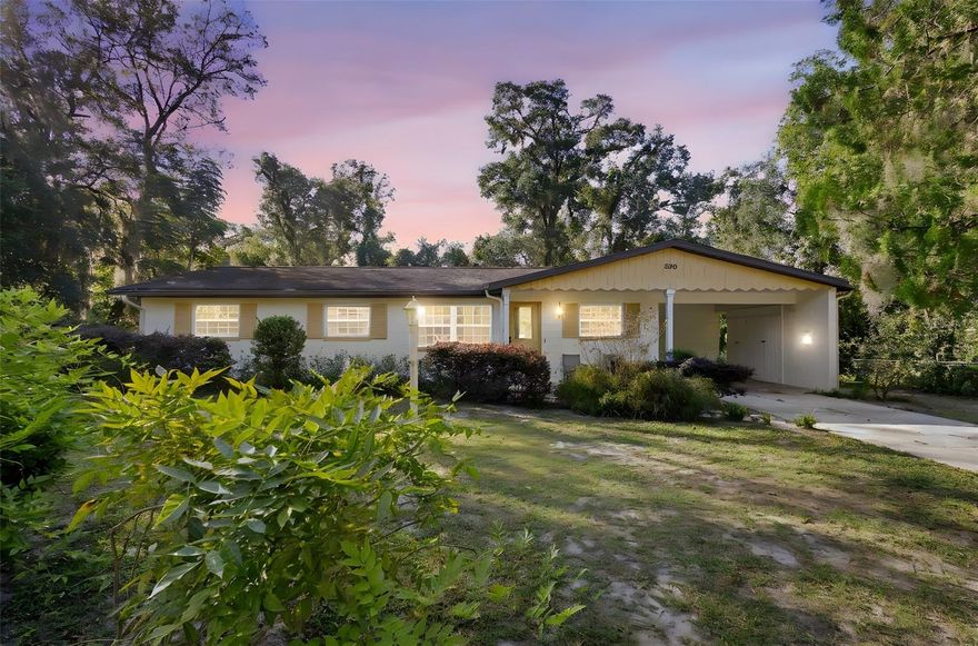 One or more photo(s) has been virtually staged. Welcome to this charming concrete block home featuring 3 bedrooms, 2 baths, and over 1,800 square feet of comfortable living space. Nestled on a quiet street in a well-kept neighborhood, this home is just a short walk to George Marks Elementary and offers both character and convenience.
Enjoy numerous updates including double-pane windows, stainless steel appliances, a new HVAC (2024), new drain field (2020), and a freshly painted exterior. Inside, you’ll find beautiful original hardwood floors, ceiling fans in every room, and an updated hall bath with a tiled tub/shower combo, new vanity, and commode. The primary bedroom also features its own private bath with updated fixtures.
Entertain with ease in the spacious 18x26 second living area, highlighted by stunning redwood beams and wall-to-wall windows that fill the space with natural light. Additional features include a large laundry room with extra storage, a covered carport, and a fully fenced backyard with a storage shed, all on nearly one-third of an acre.
This home is full of warmth, character, and potential — a wonderful opportunity to make your own in the heart of DeLand!