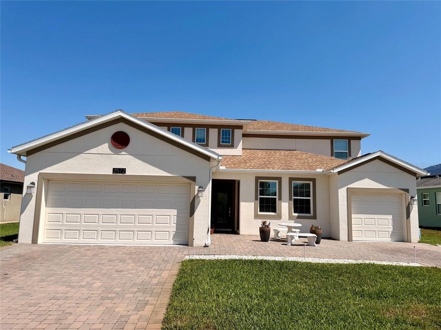 Rarely available and highly sought-after, this stunning NexGen home was thoughtfully designed for true multigenerational living — a floorplan that is becoming harder and harder to find. Featuring 6 bedrooms and 4.5 bathrooms, this exceptional residence offers a fully private in-law suite with its own separate entrance and private one-car garage with custom cabinetry.

The attached suite is ideal for extended family or guests and includes a full kitchen, spacious living room with a beautiful stone accent wall and fireplace, private laundry closet, full bathroom, and a bedroom with walk-in closet, while still maintaining interior access to the main home for added convenience.

The main residence features 5 bedrooms and 3.5 baths, a formal dining room, expansive great room, and an open-concept kitchen complete with a large center island, breakfast bar, breakfast nook, and walk-in pantry. Elegant ceramic tile flows throughout the first floor, while upstairs offers a spacious loft and additional bedrooms perfect for flexible living, entertaining, or working from home.

The primary suite offers a relaxing retreat with a large walk-in closet and spa-style bathroom featuring dual vanities, a garden tub, and separate walk-in shower. For added comfort and efficiency, each living area has its own A/C system, along with a Unifi smart home system controlling key home functions.

Additional upgrades include a water softener system, upgraded irrigation, rain gutters, and an extended front paver driveway that enhances the home’s curb appeal with a clean, modern finish.

Located inside the highly desirable Providence golf community, residents enjoy resort-style amenities including a championship 18-hole golf course, 24-hour guarded gate, resort pools, fitness center, tennis and pickleball courts, dog park, playgrounds, and scenic walking trails.

Conveniently located just minutes from Disney, I-4, Posner Park, shopping, dining, and major attractions — offering the perfect blend of luxury, comfort, and Central Florida living.