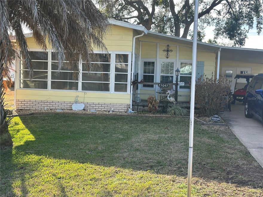 More photos coming. Partially furnished 2-bedroom 2 bath. Move in ready. A 55+ community Located in the Pine Hill village within Plantation at Leesburg. This is at 55+ community with resort style amenities. This home offers 1188 sq ft of living space and ready to move in. Tenant there until end of March. New doors and windows installed in Dec of 2022, New roof in 2019, HVAC 2004.
Sunroom on front of the home completely glassed in. Extra storage is at the back of the covered carport that can be used as a workshop.
This vibrant community has 2 Champions golf courses, three pools, Clubhouse, pickleball courts, Tennis, billiards, Fitness classes, arts and crafts and 24-hour security. Close to Medical facilities, restaurants ad multiple lakes in the Leesburg area and the Villages plus a short drive to Orlando. Golf cart included New buyers require HOA Approval with a one time $250 Transfer fee`.