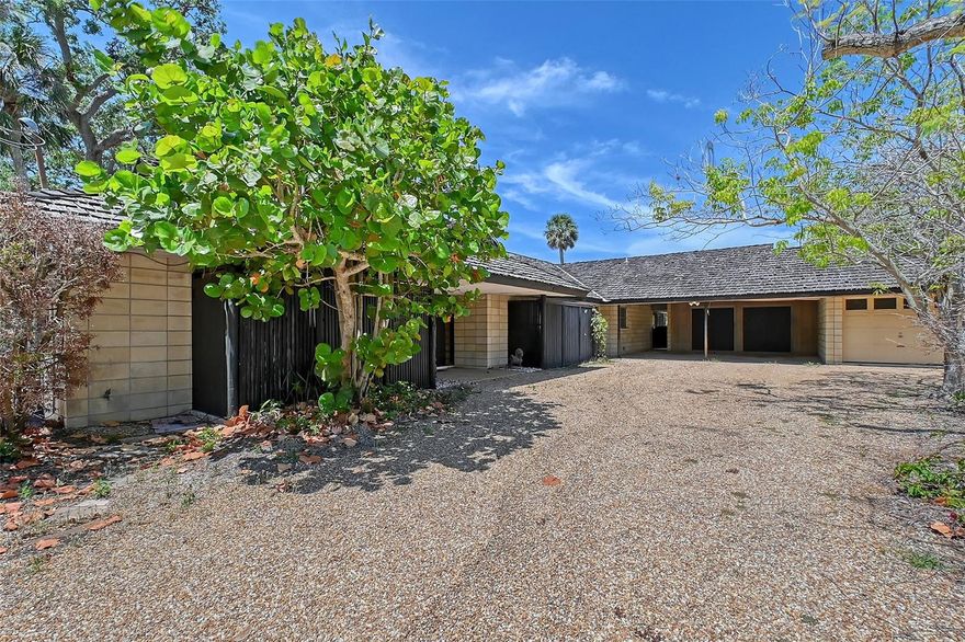 Build your Dream Home on this Siesta Isles Canal Front lot just a short walk to the cool powdery quartz sands of Siesta Key. This 14,200 square foot lot is located boasts approximately 80 feet on a deep canal with a boat dock. New homes and extensive renovations are occurring in this fabulous neighborhood with its excellent boating water and close proximity to the beach. The current home experienced some water intrusion during Hurricane Helene (but not Milton).