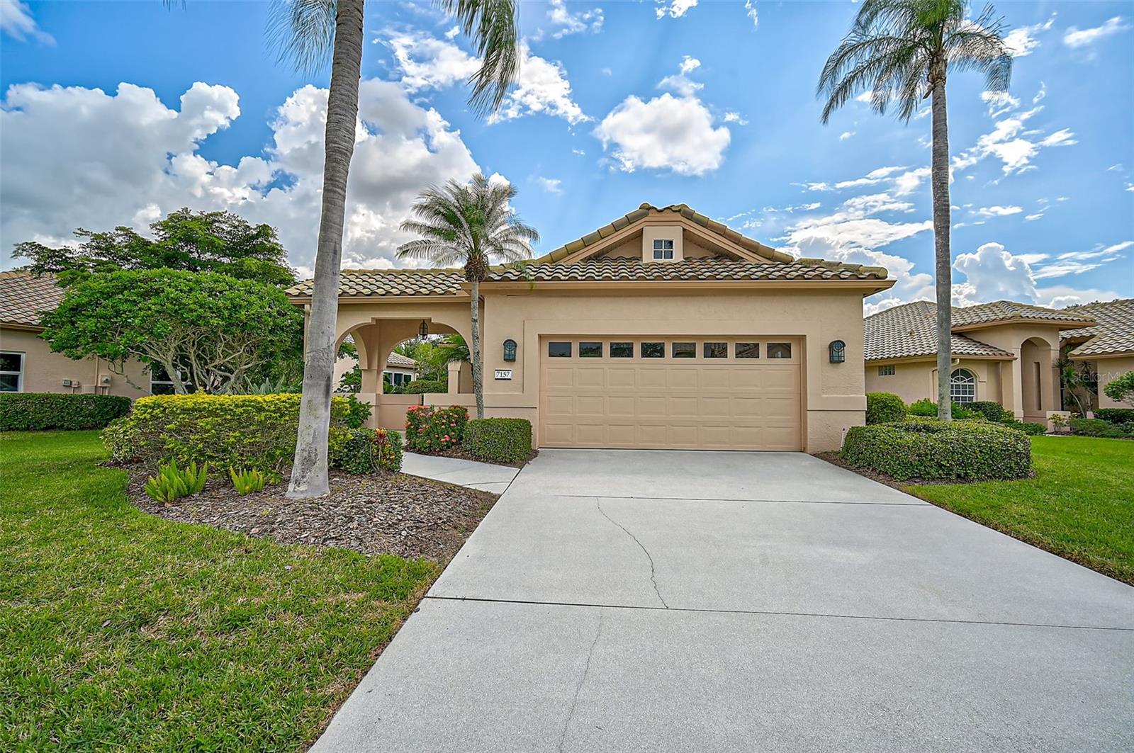 Rare opportunity - Motivated Seller! Features include an expanded garage, a newer roof (2016), HVAC (2013), and storm shutters! This 2 bed, 2 bath plus den, lakefront beauty is located in the sought-after, maintenance-free community of Mira Lago at Palmer Ranch. This beautifully appointed home features classic architectural details, voluminous ceilings with crown molding in the living room, custom built-ins in the den, plantation shutters, and custom blinds. The spacious eat-in kitchen with an abundance of cabinets opens to the living area, complete with warm ceramic tile throughout. The large screened paver lanai offers serene lake views. The private primary bedroom, tucked away at the back of the home, boasts an en-suite bath with a walk-in open shower, split vanities, and 2 cedar walk-in closets.
Mira Lago is a gated community on the northwest edge of Palmer Ranch, offering low HOA fees and no CDD. Included in the HOA are ground maintenance, irrigation, landscaping services, mulching, power washing of driveways and roofs, and exterior painting every seven years. Basic cable and high-speed internet are also included, along with pest control services for both the interior and exterior, all for a low quarterly fee of $1196. The community includes a heated pool and spa, offering maintenance-free luxury and a laid-back Florida lifestyle. Palmer Ranch itself is home to commercial, recreational, and assisted-living facilities, and features two exceptional golf courses, TPC Prestancia and Stoneybrook, with optional membership. You’re just minutes from the stunning Siesta Key beaches, CORE SRQ South Branch, Potter Park & Selby Aquatic Center, Westfield Shopping Center with Costco and movie theaters, as well as Sarasota Airport, Asolo Repertory Theatre, the Ringling Museum, and nearby sister islands for the perfect beach day.