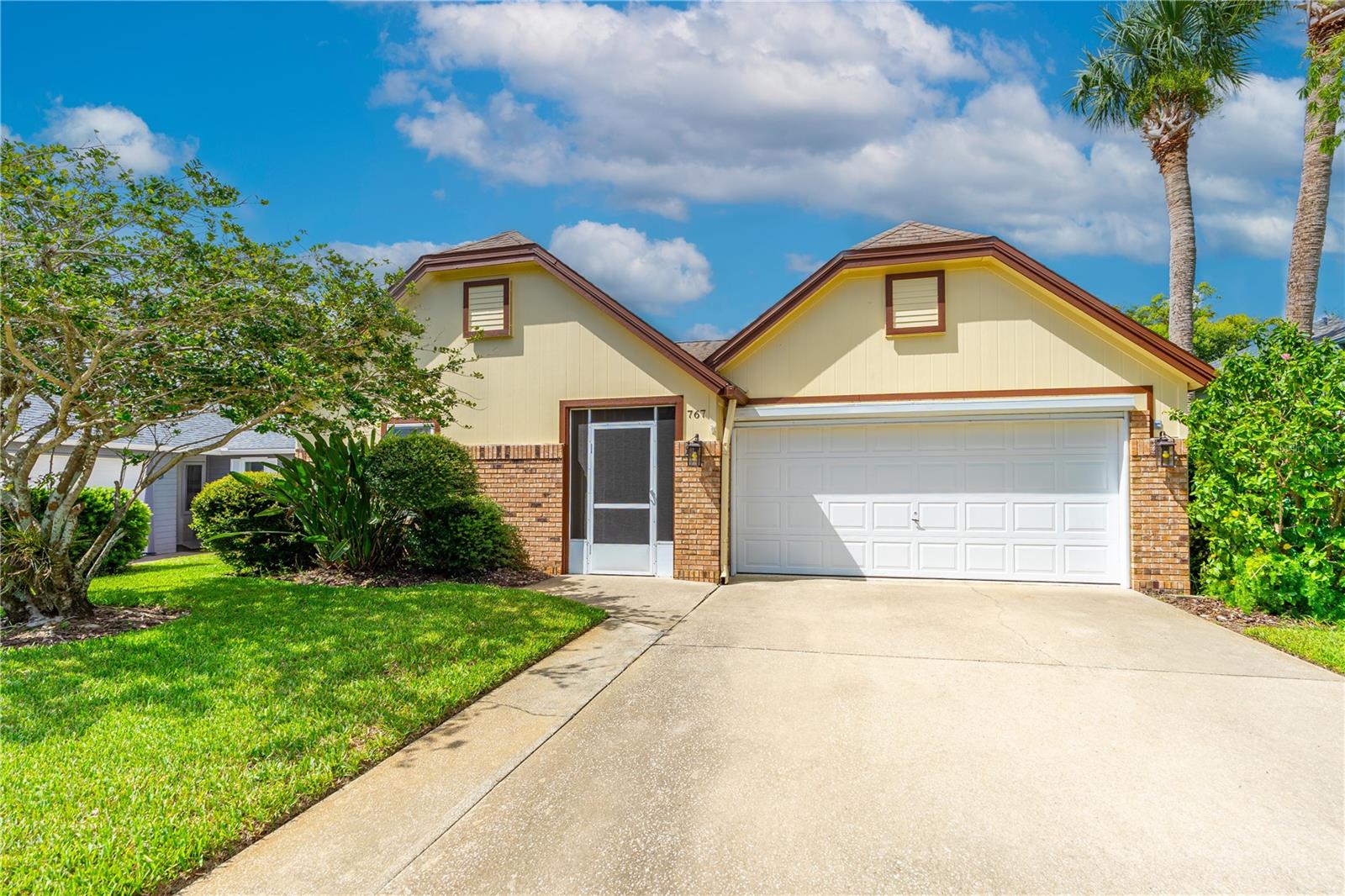 Welcome to this beautifully remodeled 3-bedroom 2-full bath home with a bright, open layout featuring tasteful finishes throughout. The home offers a calming view of the community lake for the relaxing and peaceful lifestyle in the highly sought-after New Smyrna Beach! This is truly move-in ready and offers a perfect blend of modern comfort and tranquil surroundings. Step inside to discover a fresh and stylish interior with open floor plan with a spacious kitchen designed to accent the ample natural light. The home is highlighted by an inviting primary suite complete with a luxurious new jetted tub and a walk-in shower with steam-friendly design—your own private spa retreat. The home features an attached garage with large roll-down screen door and built-in cabinetry, offering clean, organized storage for all your needs. Enjoy your morning coffee or unwind in the evening on the screened rear porch, which overlooks a peaceful lake framed by lush landscaping creating a picturesque backdrop for daily relaxation. As part of the Pine Island community, you'll have access to a sparkling pool and other recreational amenities designed to support both relaxation and an active lifestyle. Located just minutes from the most beautiful beaches, golfing, shopping, and best dining, this home offers the best of New Smyrna Beach living in a quiet, well-maintained neighborhood.