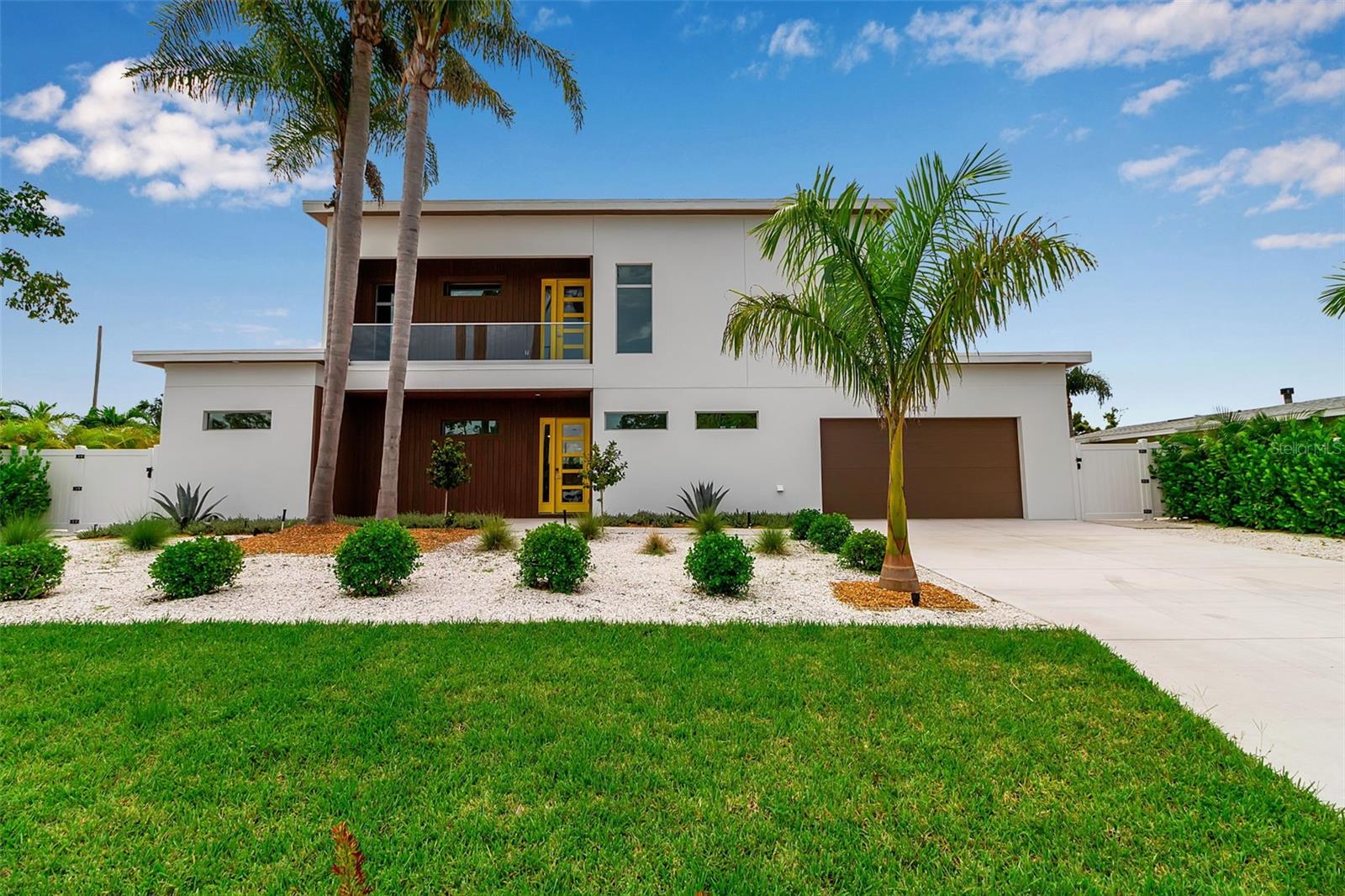 This newly built 6-bedroom, 6-bathroom residence offers the perfect blend of contemporary design, luxurious comfort, and Florida lifestyle living. Ideally located in Sarasota, this home is just moments from the areas renowned beaches, vibrant downtown, and premier dining and shopping. From the moment you step inside, you're greeted by an open, sun-filled floor plan with high ceilings, expansive windows, and sleek tile flooring create a bright and inviting atmosphere. The modern kitchen is a showpiece, featuring streamlined modern cabinetry, premium LG appliances, and generous counter space for both casual meals and gourmet entertaining. The primary suite is conveniently located on the ground floor, offering a private retreat with a spacious layout and spa-inspired en-suite bath. Additional bedrooms are equally well-appointed, providing comfort and privacy for family and guests alike.
Designed with both relaxation and connection in mind, the main living area flows seamlessly to the outdoors. Here, a sparkling pool surrounded by a spacious patio sets the stage for lazy afternoons in the sun, evening cocktails, or memorable gatherings under the stars.