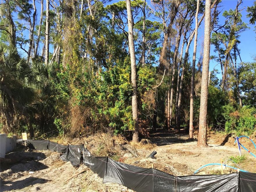 Site development is scheduled for completion in March 2026. The Estates at Eniswood is a small, private community featuring just seven residential lots, ideally situated and surrounded by the established Eniswood and Autumn Woods neighborhoods. Lot 1 is a desirable corner lot with only one adjacent neighbor, and conservation area in back offering added privacy. This is a Design & Build community, allowing buyers to bring their own home plan, design a custom home, or choose from existing plans offered by the builder. The minimum required living area is 2,000 square feet. All home elevations and site layouts are subject to developer approval to ensure architectural consistency throughout the community. All public utilities are underground, including water, sewer, electric, and natural gas. Property is located in Flood Zone X (X500) — no flood insurance required. Buyers must use the developer’s designated builder, Somerfield Construction. The Estates at Eniswood is located within the highly rated Palm Harbor school zone and is just minutes from downtown Palm Harbor, dining, shopping, local parks, Gulf beaches, the Tarpon Springs Sponge Docks, the Pinellas Trail, and more. Seller holds an active Florida Real Estate Broker License.