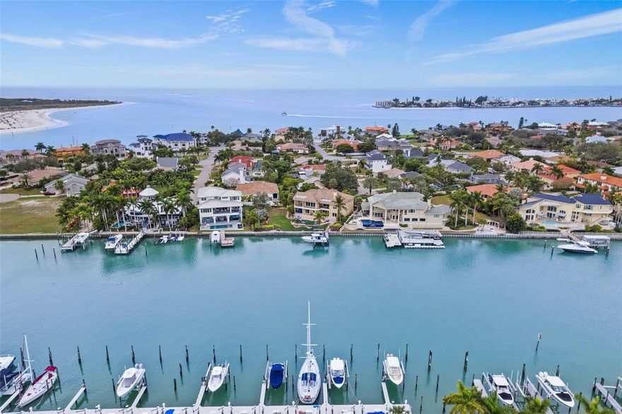 NO FLOODING IN HELENE OR MILTON!
Welcome to waterfront luxury living at its finest! Introducing a spectacular and BEAUTIFULLY RENOVATED residence along the prestigious Grand Canal of Tierra Verde. This meticulously crafted home offers an array of exquisite features that redefine opulence. Step into the backyard oasis where a beach entry pool with spa awaits, offering the perfect retreat for relaxation and entertainment. Overlooking the approximately 112-foot seawall, this residence provides not only breathtaking views but also the ability to accommodate a very large vessel. A new composite dock with two boat lifts beckons to those with a passion for maritime adventures, providing easy access to scenic waterways and leading directly to the Gulf of Mexico. This residence features five bedrooms, each thoughtfully designed to provide tranquility and privacy with its own en-suite full bath. Discover the allure of the billiards room, perfect for lively gatherings, and a well-appointed in-house gym for the fitness enthusiast. An inviting den provides a cozy space for work or relaxation, while the extra side lot offers endless possibilities and features lush tropical landscaping. Culinary enthusiasts will appreciate the gourmet kitchen equipped with a top-of-the-line professional grade appliances, creating a haven for culinary creativity. Situated in a premier waterfront location, this residence offers not just a home but a lifestyle. Enjoy quick and convenient boat rides to the Gulf of Mexico, embracing the essence of coastal living. Immerse yourself in the luxury and tranquility that defines this Tierra Verde gem – a residence where every detail has been meticulously curated for those who seek the pinnacle of waterfront living. Additional features include a spacious 3-car garage, providing ample space for your vehicles and storage needs. Situated on a quiet cul-de-sac, this home offers a peaceful retreat within the exclusive Tierra Verde community. The circular driveway adds a touch of elegance and convenience to welcome you to this extraordinary residence. Experience the perfect blend of sophistication and coastal charm in this Tierra Verde waterfront masterpiece. The top ranked beaches of Fort DeSoto and St. Pete Beach are close in proximity as is the vibrant downtown St. Pete making this an ideal location to call home.